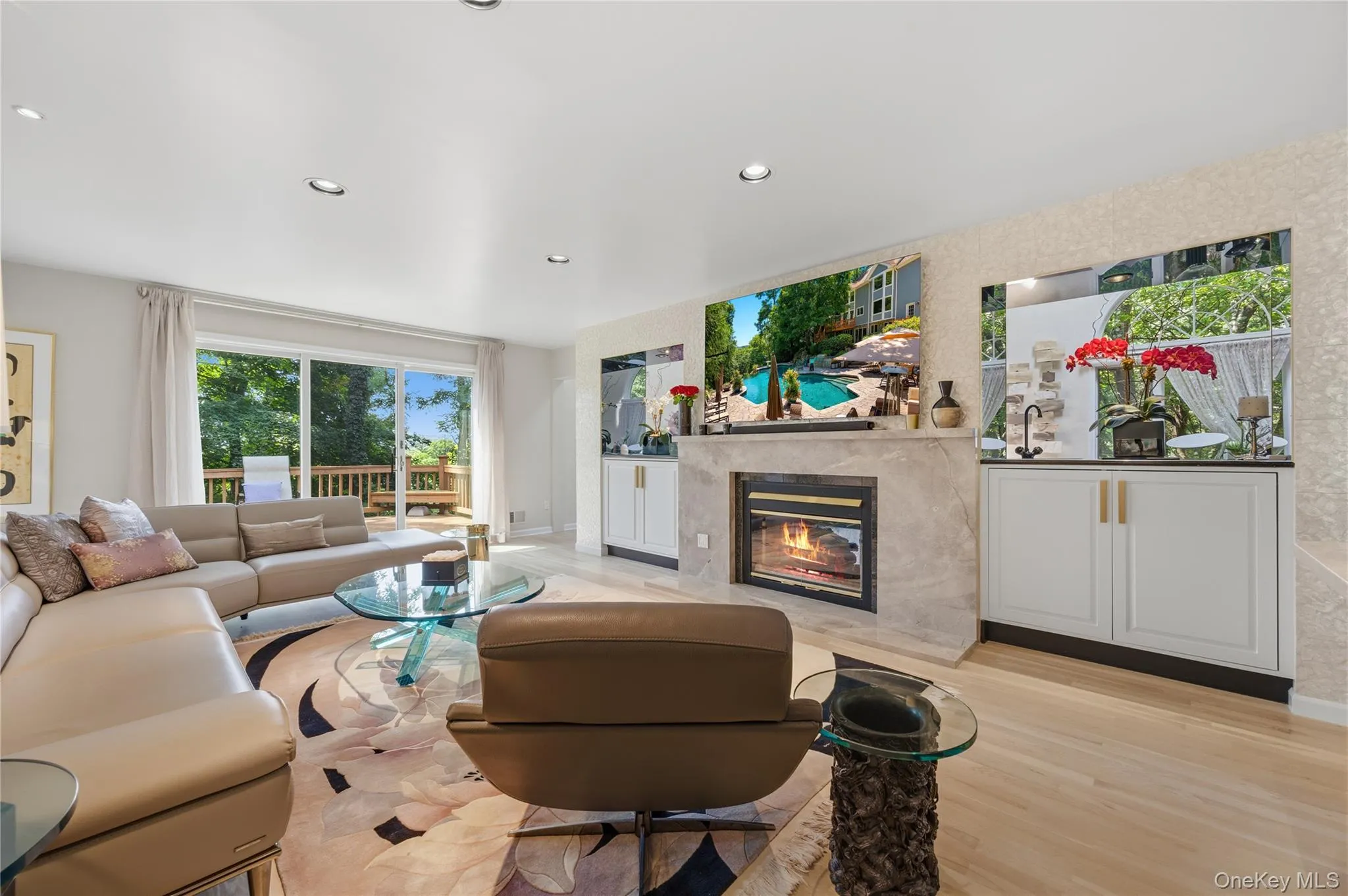 Family Room with sliding glass door to deck, recessed lights, wood burning Fireplace with marble surround, Wet Bar & B/I cabinets, Mother of Pearl accent wall Family Room with sliding glass door to deck, recessed lights, wood burning Fireplace with marble surround, Wet Bar & B/I cabinets, Mother of Pearl accent wall