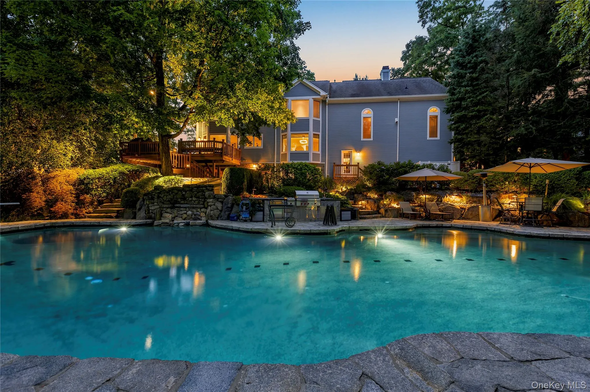 Exterior lighting adds to the beauty of the pool area at night Exterior lighting adds to the beauty of the pool area at night