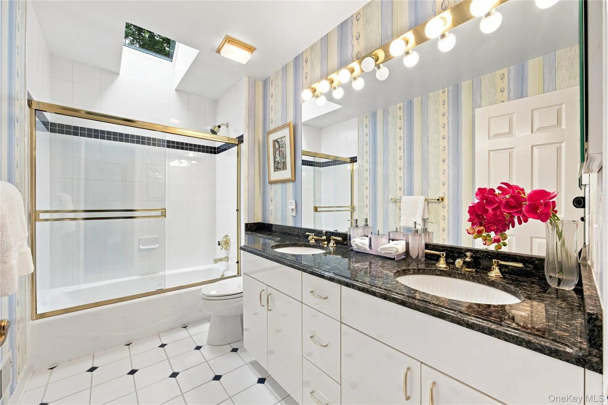 Second Hall Bathroom with two sink vanity, skylight, bathtub, mirrored medicine cabinet Second Hall Bathroom with two sink vanity, skylight, bathtub, mirrored medicine cabinet