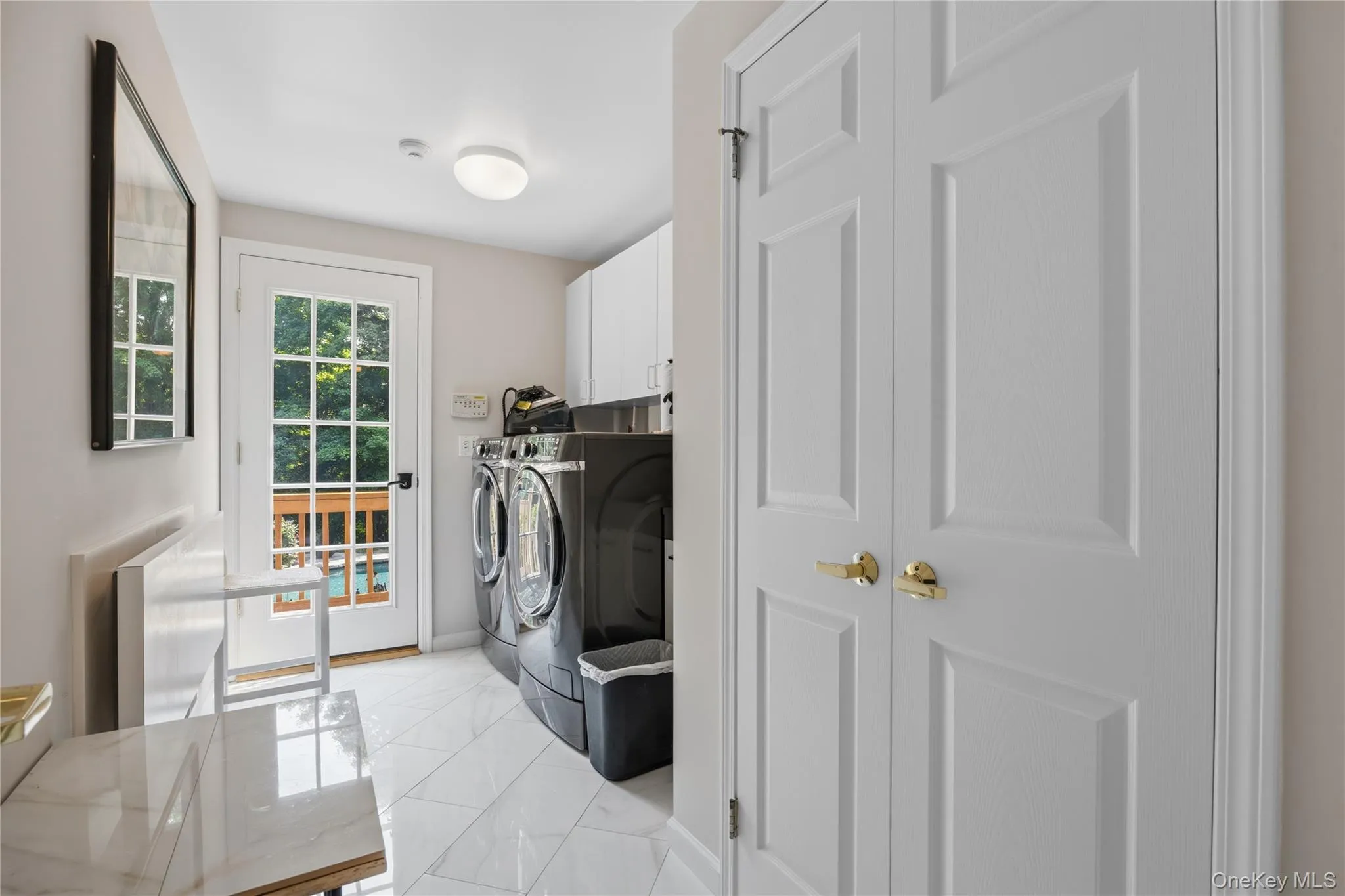 Spacious Laundry room with French Door to yard, double closets and door to 3-car garage Spacious Laundry room with French Door to yard, double closets and door to 3-car garage