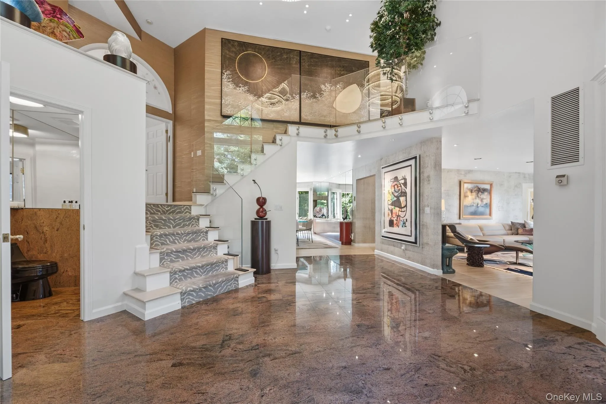 Back down through dramatic entrance foyer to Lower Level Back down through dramatic entrance foyer to Lower Level