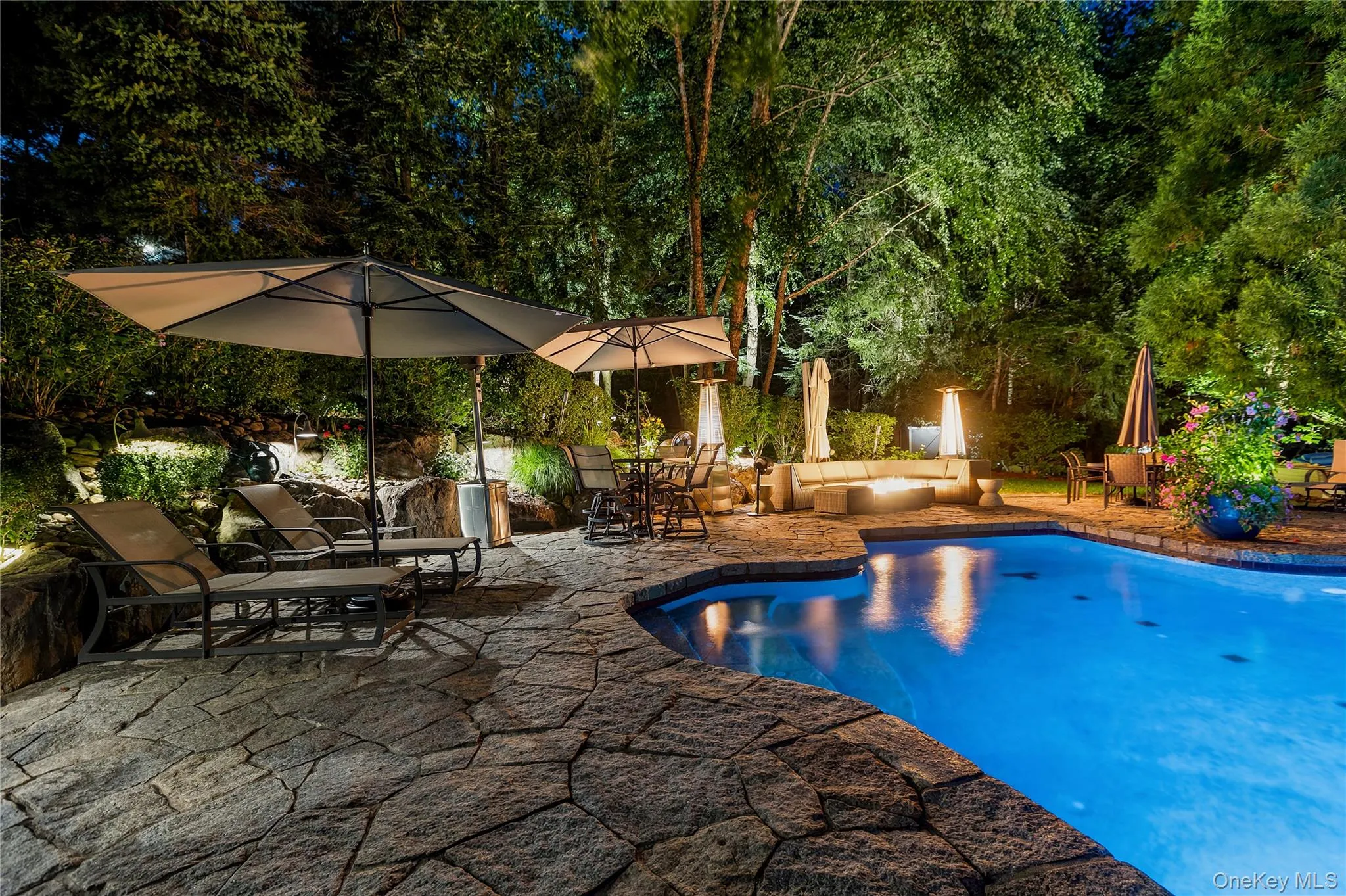 Enjoy relaxing by the pool in the evenings right into the fall with a firepit for warmth Enjoy relaxing by the pool in the evenings right into the fall with a firepit for warmth