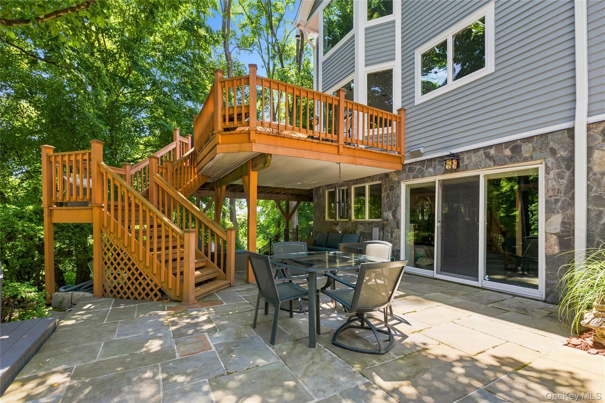 Rear Patio off of walk-out Lower Level with steps to upper Deck Rear Patio off of walk-out Lower Level with steps to upper Deck