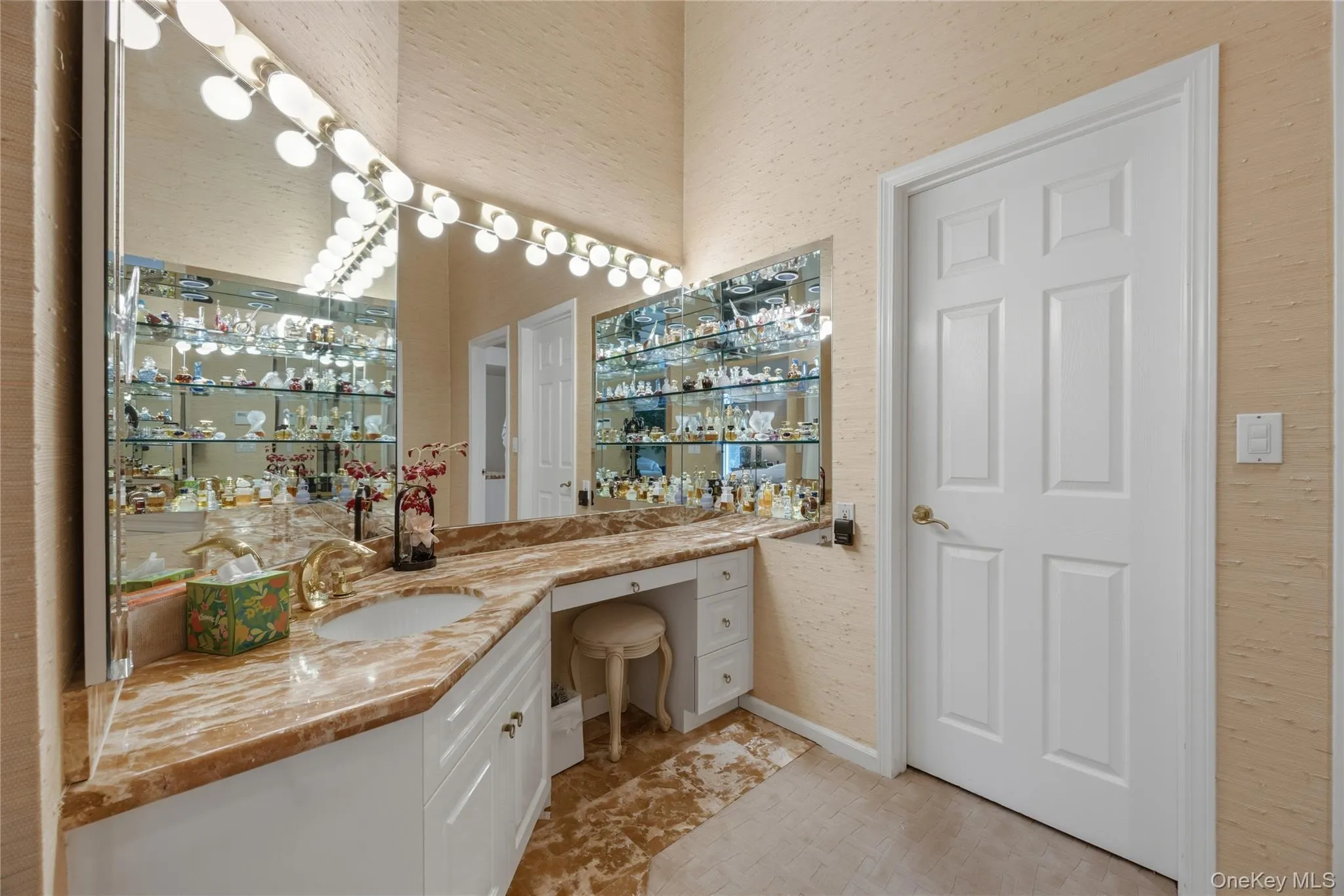 Primary Bedroom Dressing & Vanity Area with custom walk-in closet Primary Bedroom Dressing & Vanity Area with custom walk-in closet