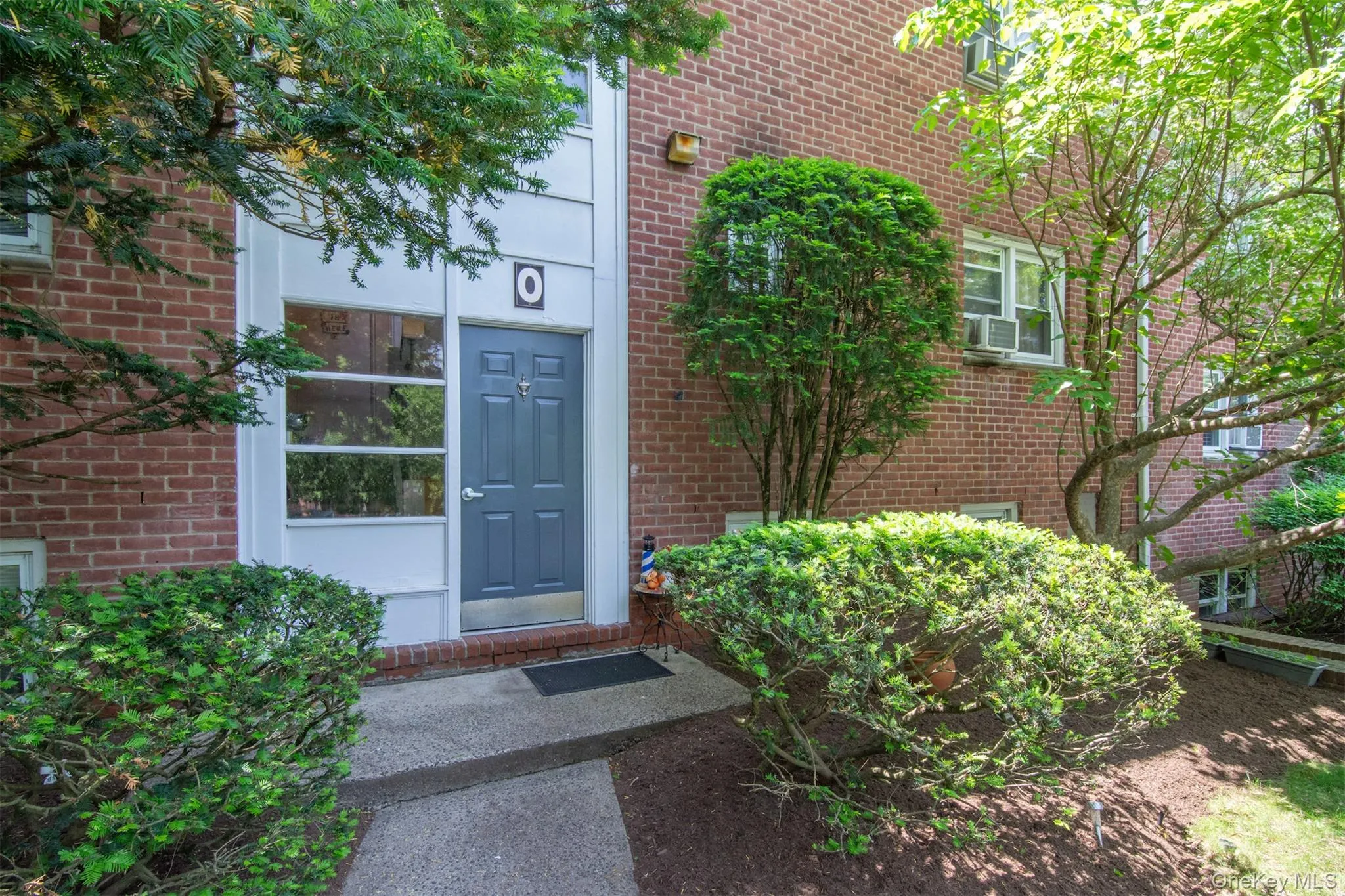 Entrance to property with brick siding Entrance to property with brick siding