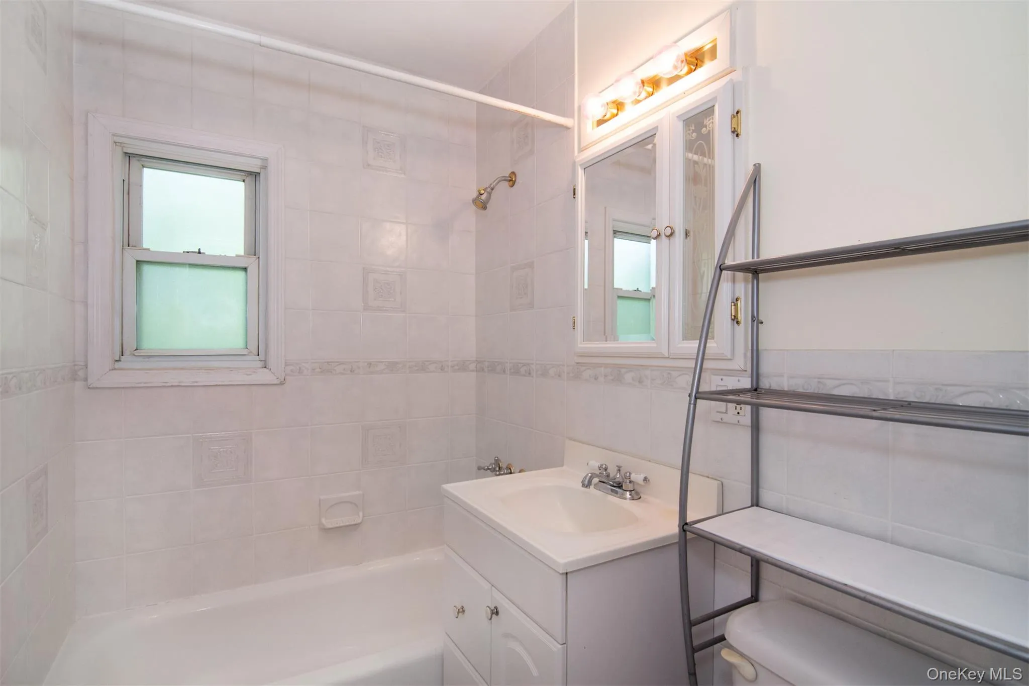 Updated primary bath with plenty of natural light Updated primary bath with plenty of natural light