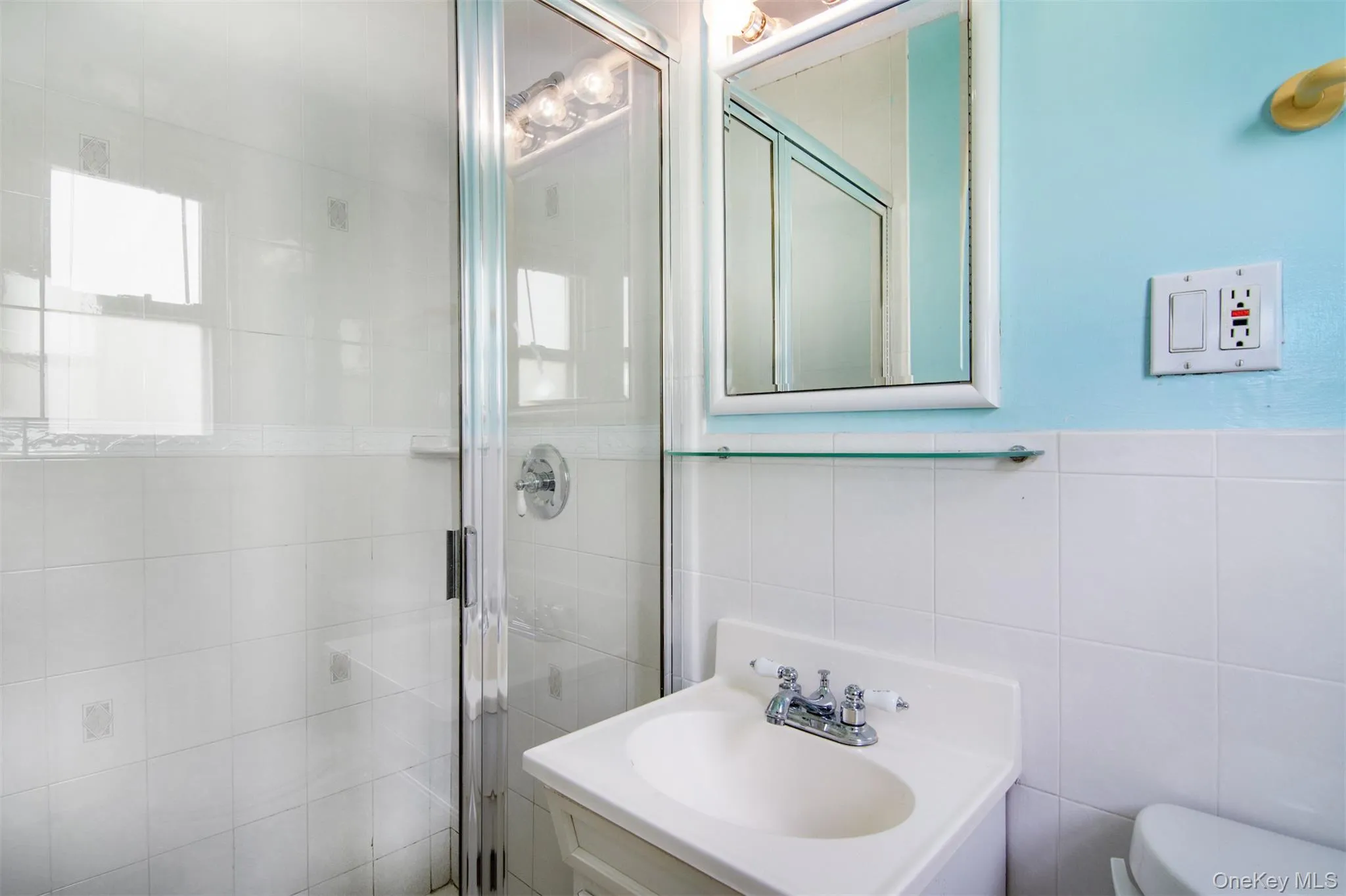 Full bathroom featuring tile walls, new vanity Full bathroom featuring tile walls, new vanity