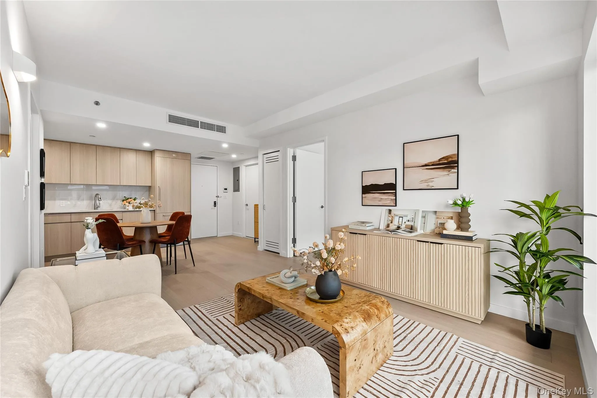 Living room with recessed lighting and light wood-style flooring Living room with recessed lighting and light wood-style flooring