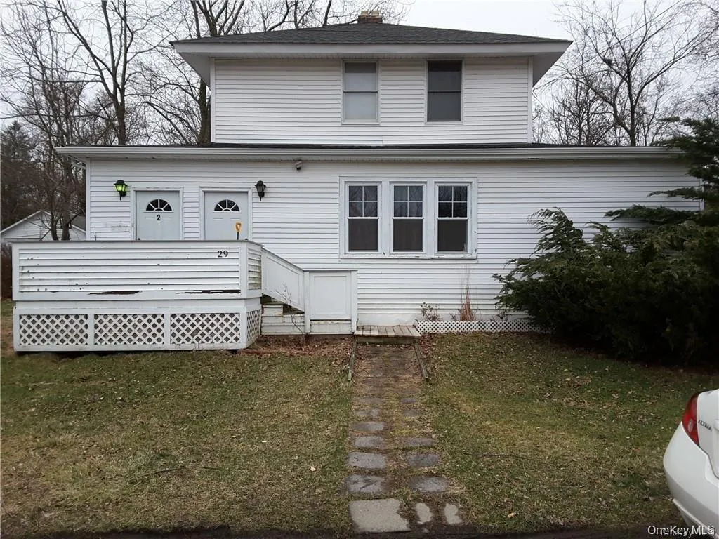 White siding exterior featuring a multi-level design White siding exterior featuring a multi-level design