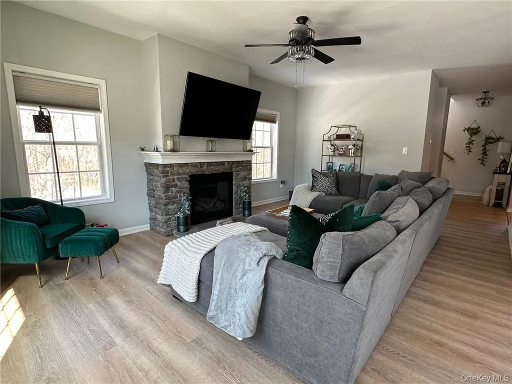 Spacious living rm with stone fireplace Spacious living rm with stone fireplace