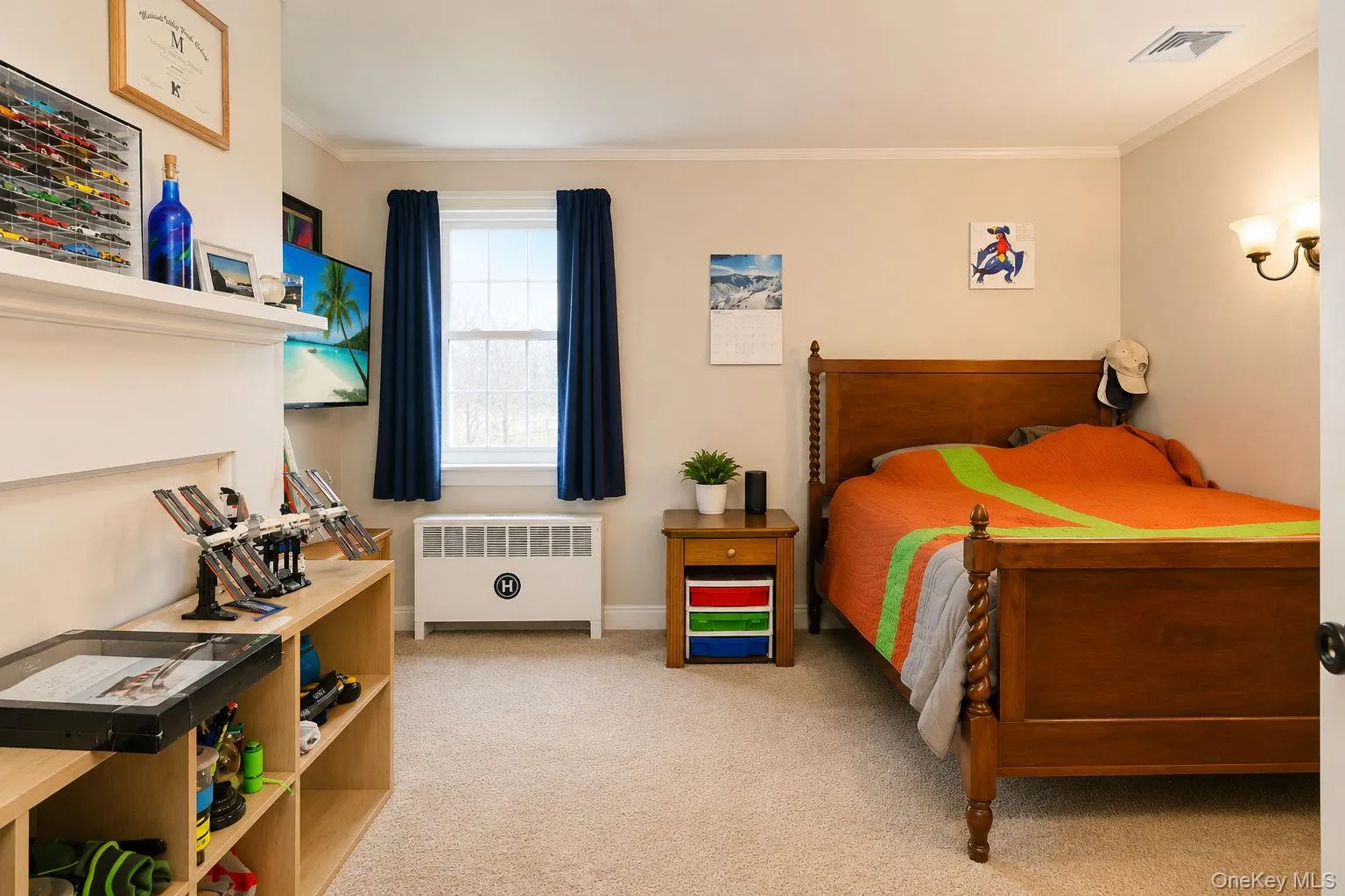 Bedroom with decorative wood mantel, carpeted flooring and light fixture Bedroom with decorative wood mantel, carpeted flooring and light fixture