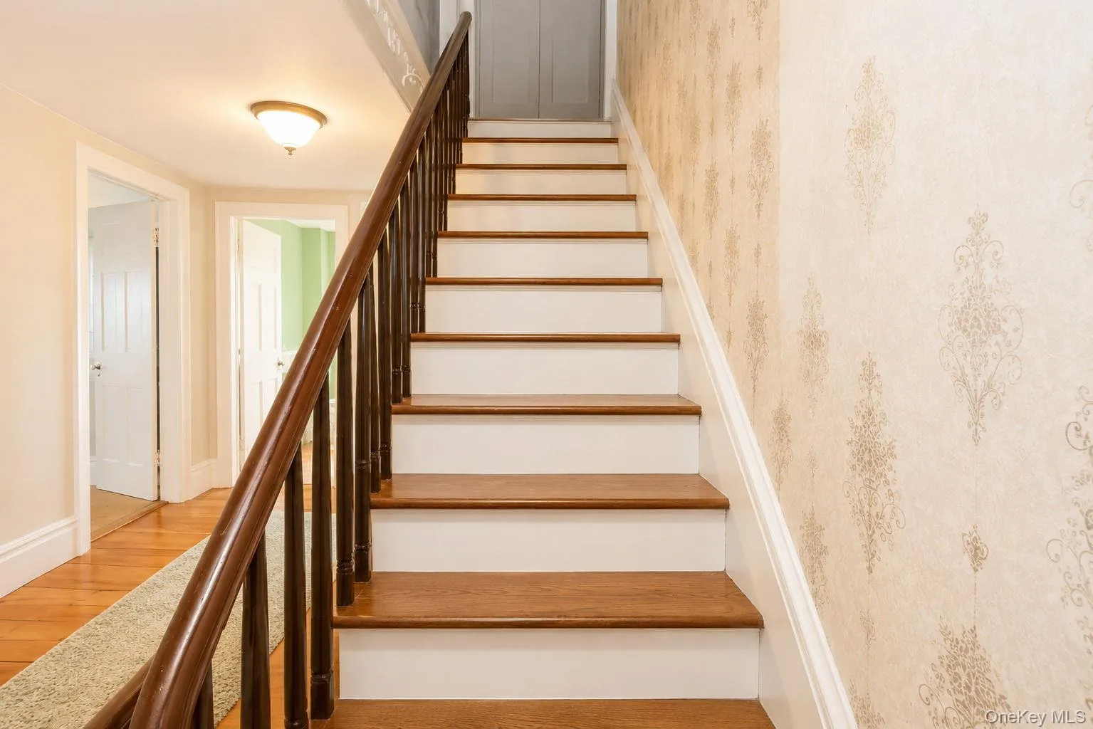 Stairway to the attic with decorative wallpaper Stairway to the attic with decorative wallpaper