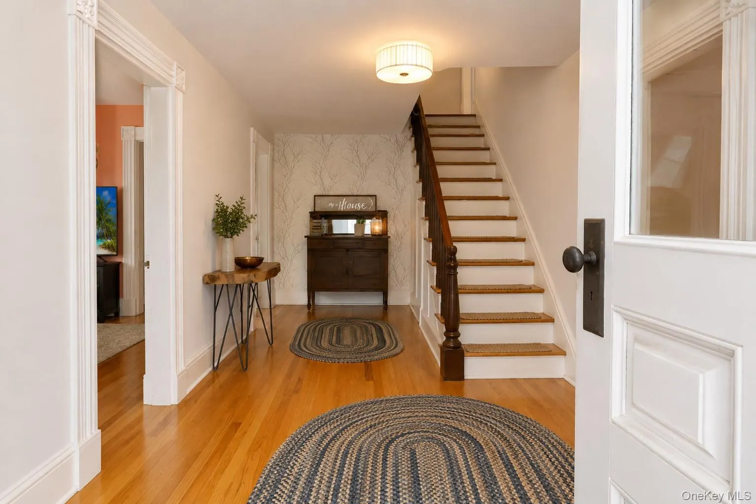 Enter to the foyer with hard wood flooring and center stairway Enter to the foyer with hard wood flooring and center stairway