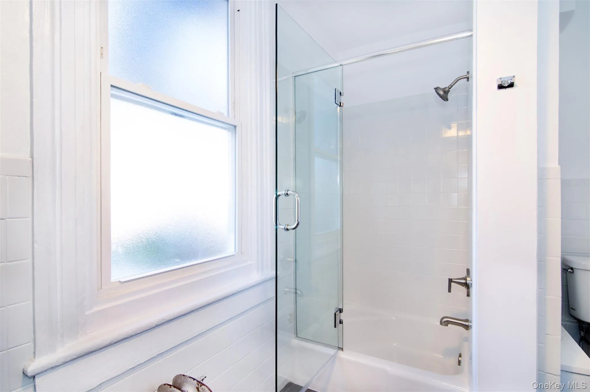 Bathroom with shower with glass door and toilet Bathroom with shower with glass door and toilet