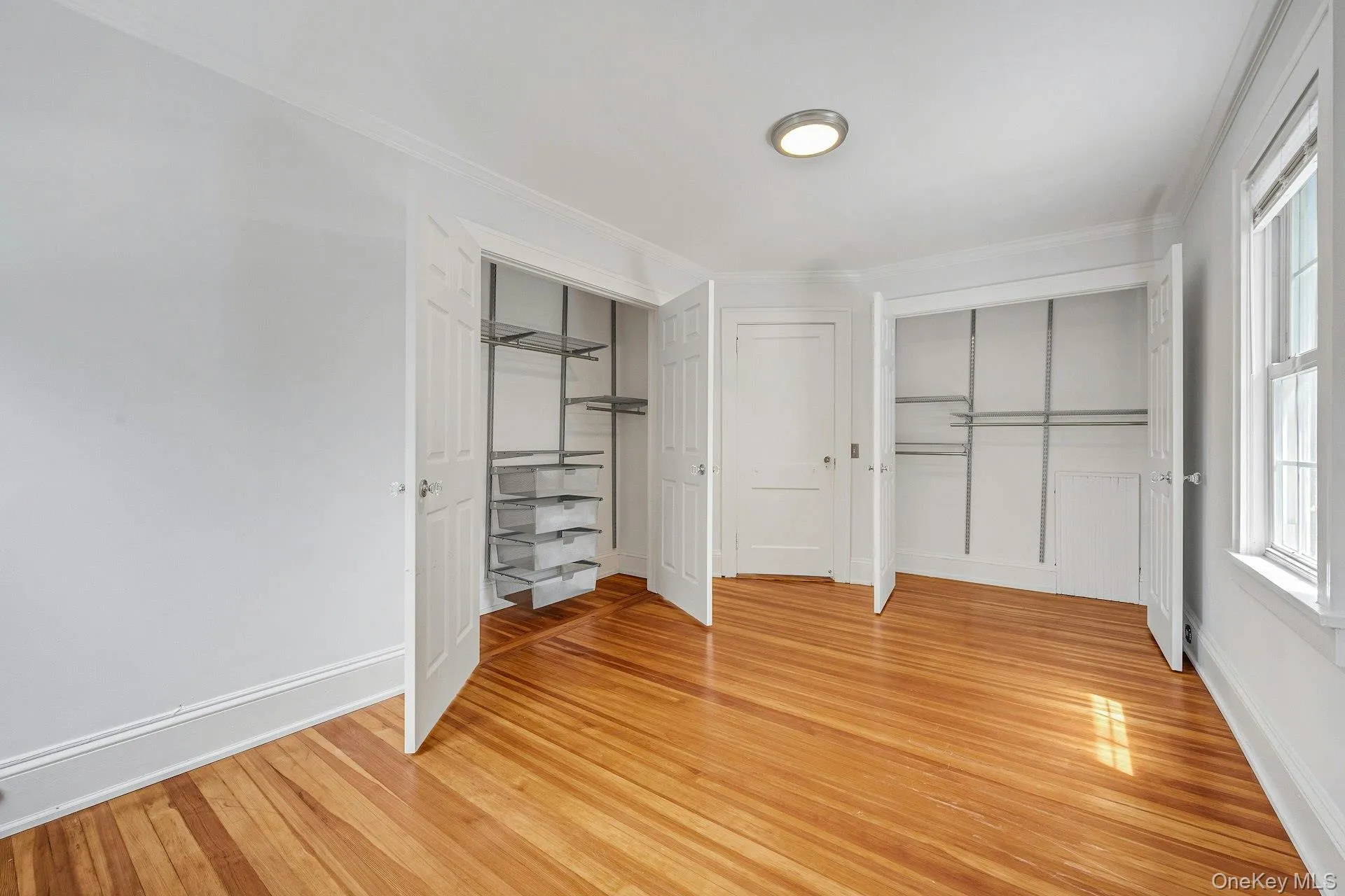 Bedroom with double door closet with built-ins Bedroom with double door closet with built-ins