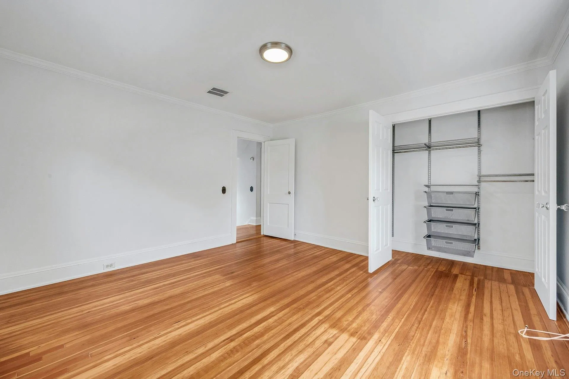 Bedroom with double door closet with built-ins Bedroom with double door closet with built-ins
