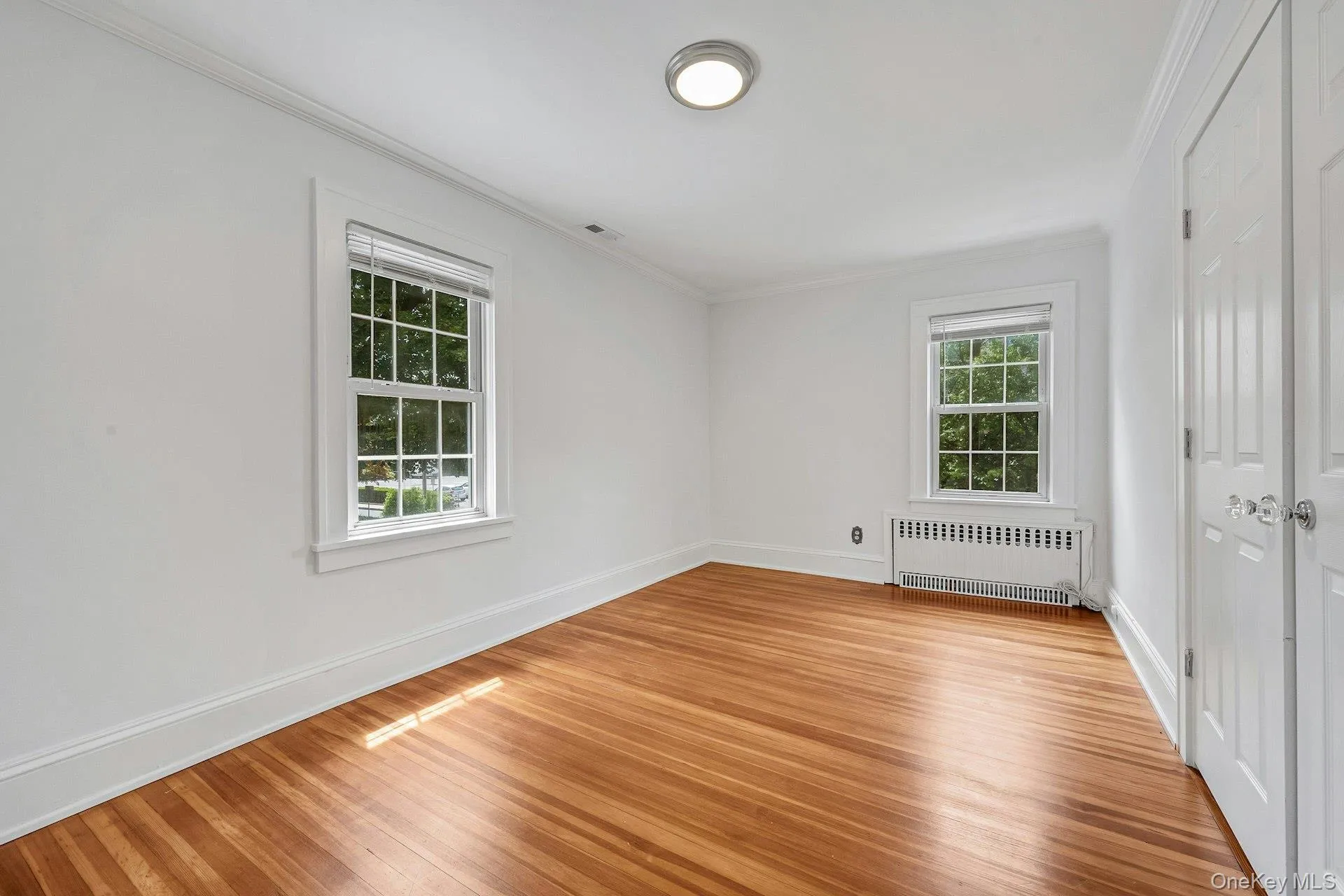 Bedroom with double door closet with built-ins Bedroom with double door closet with built-ins