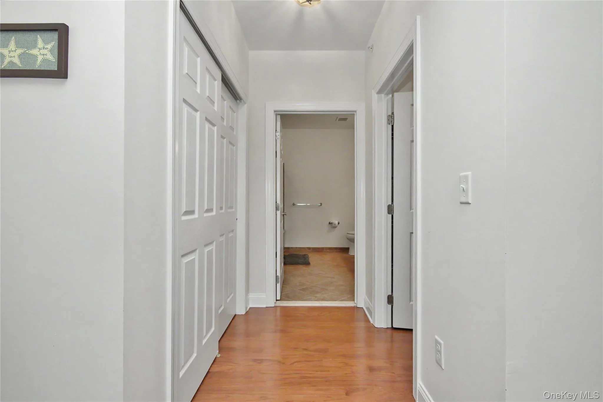 Hallway to your Primary Bathroom and His and Hers Closets Hallway to your Primary Bathroom and His and Hers Closets