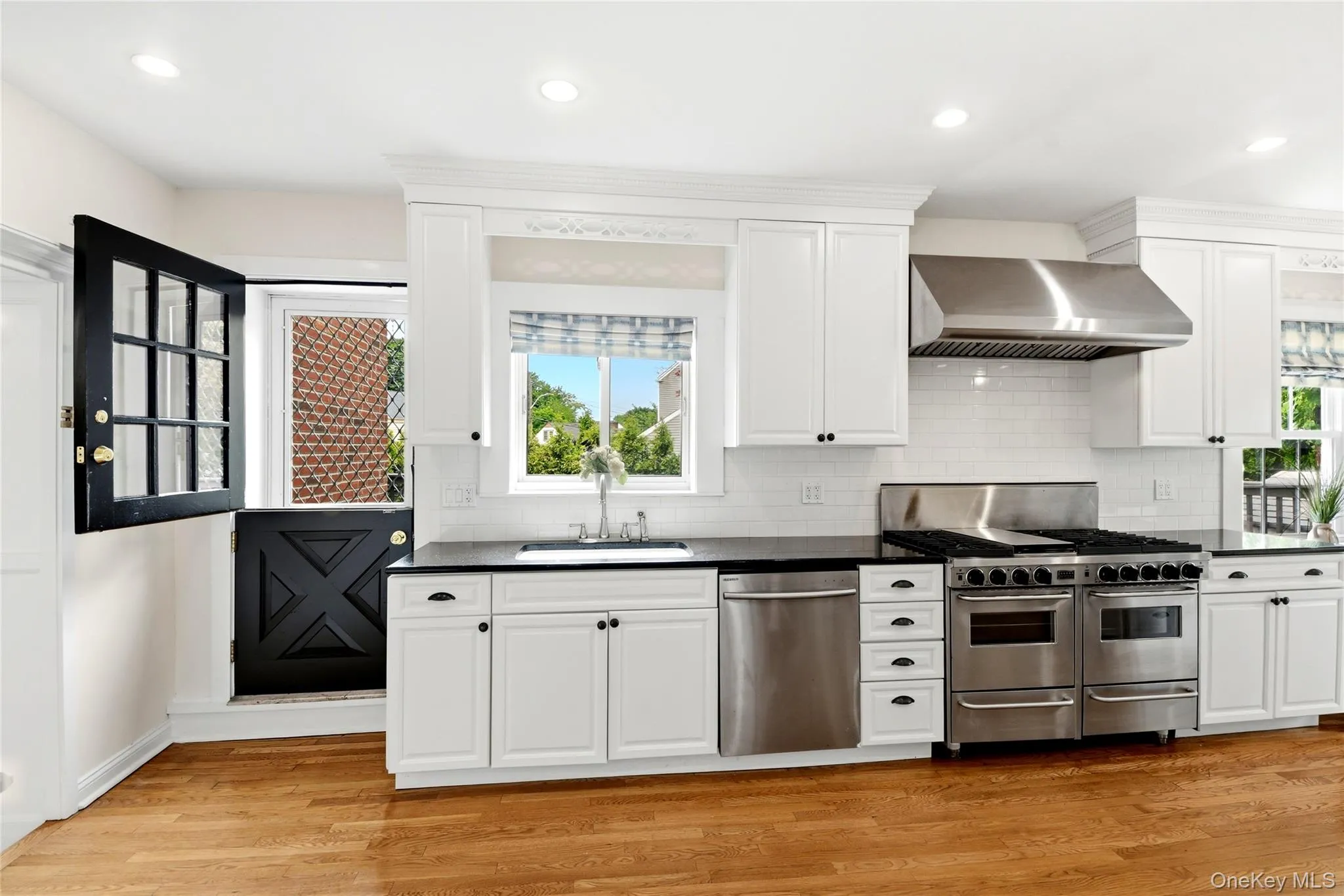 Kitchen, with dutch-door leading to deck and backyard Kitchen, with dutch-door leading to deck and backyard