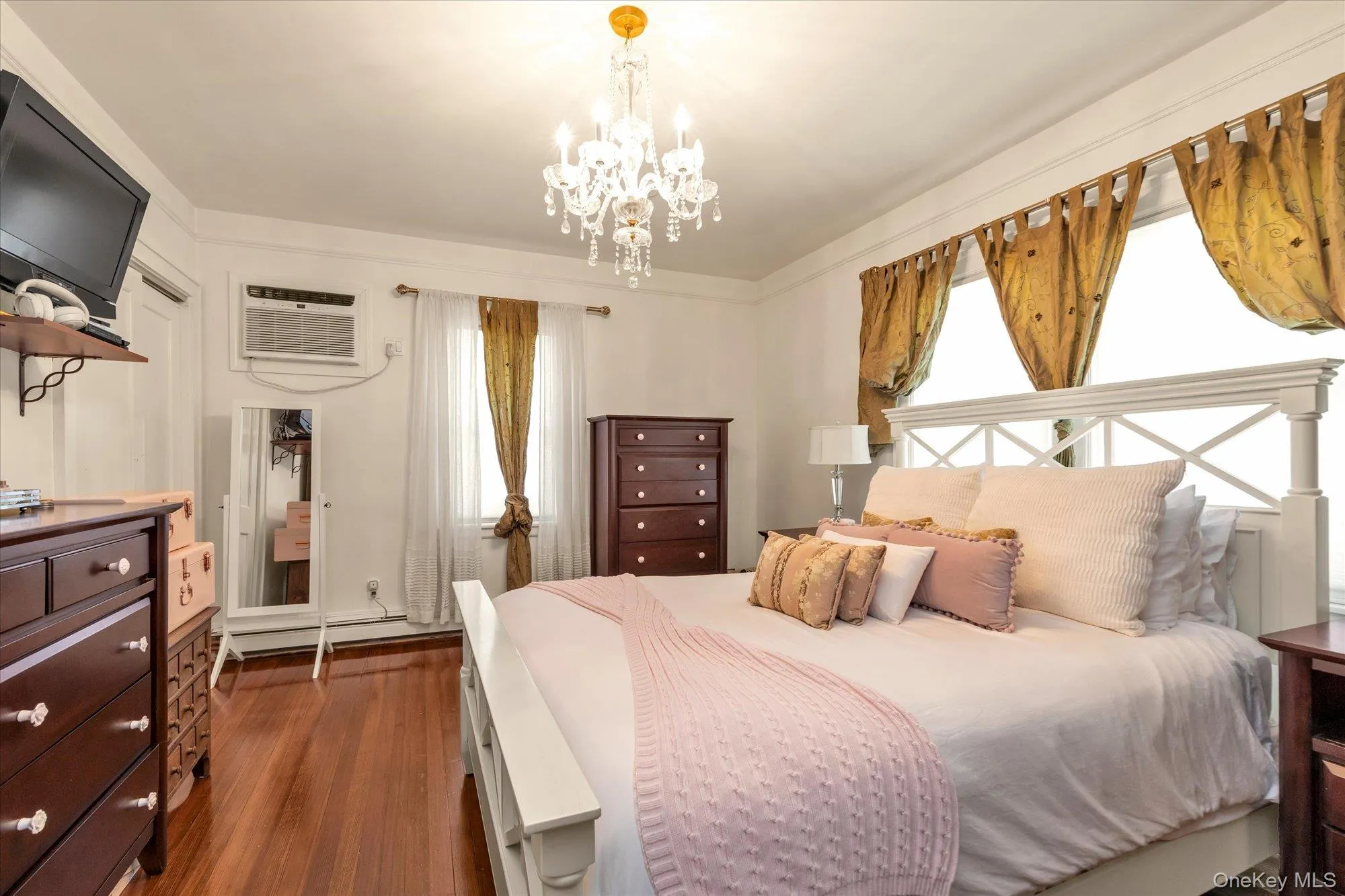 Primary Bedroom with Hardwood Floors Primary Bedroom with Hardwood Floors