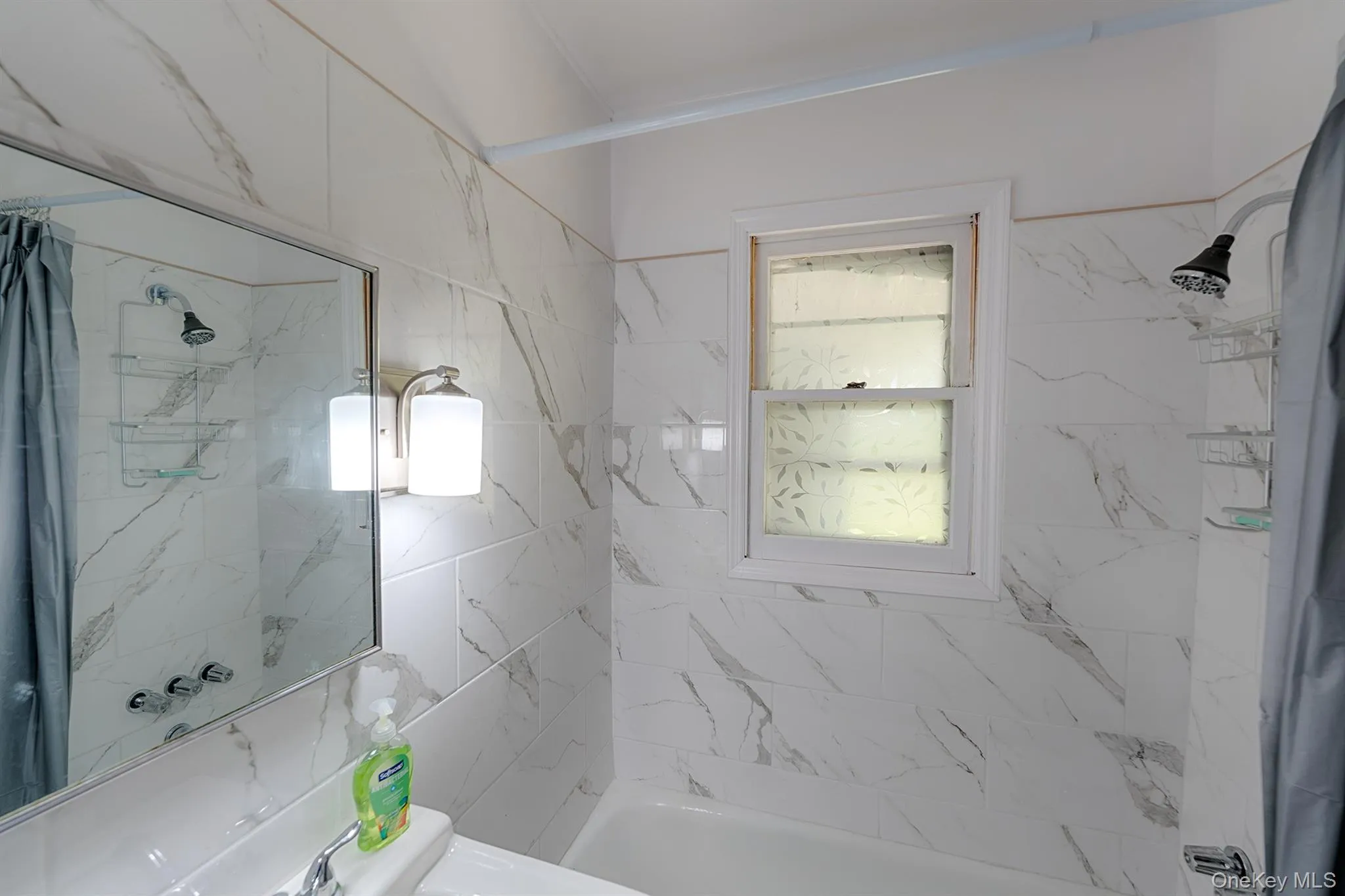 Full bath with healthy amount of natural light and bathtub / shower combination Full bath with healthy amount of natural light and bathtub / shower combination
