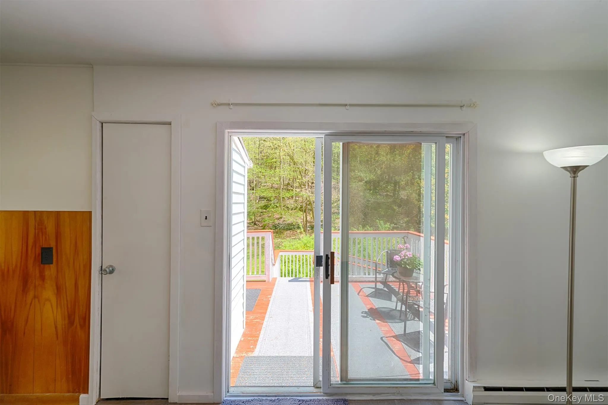 Entryway with a baseboard radiator and healthy amount of natural light Entryway with a baseboard radiator and healthy amount of natural light