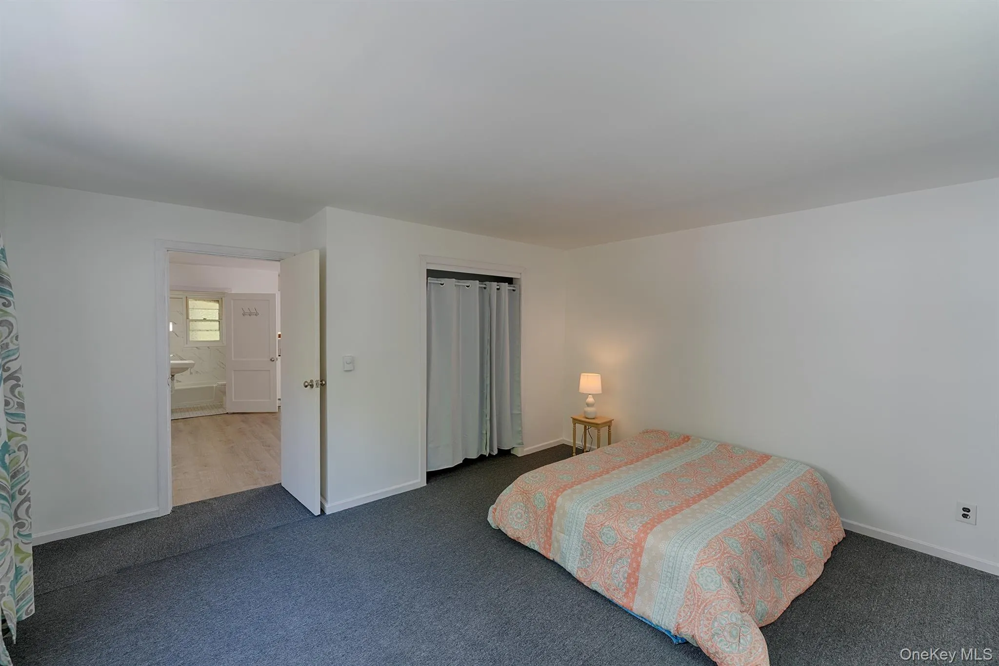 Carpeted bedroom with baseboards Carpeted bedroom with baseboards