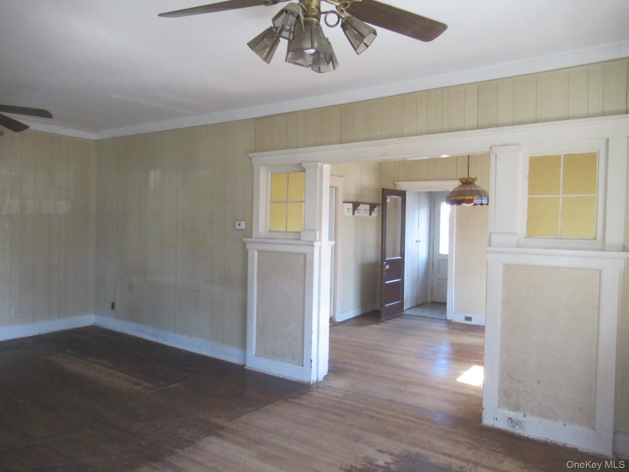 Hardwood flooring extending throughout, complemented by a ceiling fan with integrated lighting Hardwood flooring extending throughout, complemented by a ceiling fan with integrated lighting