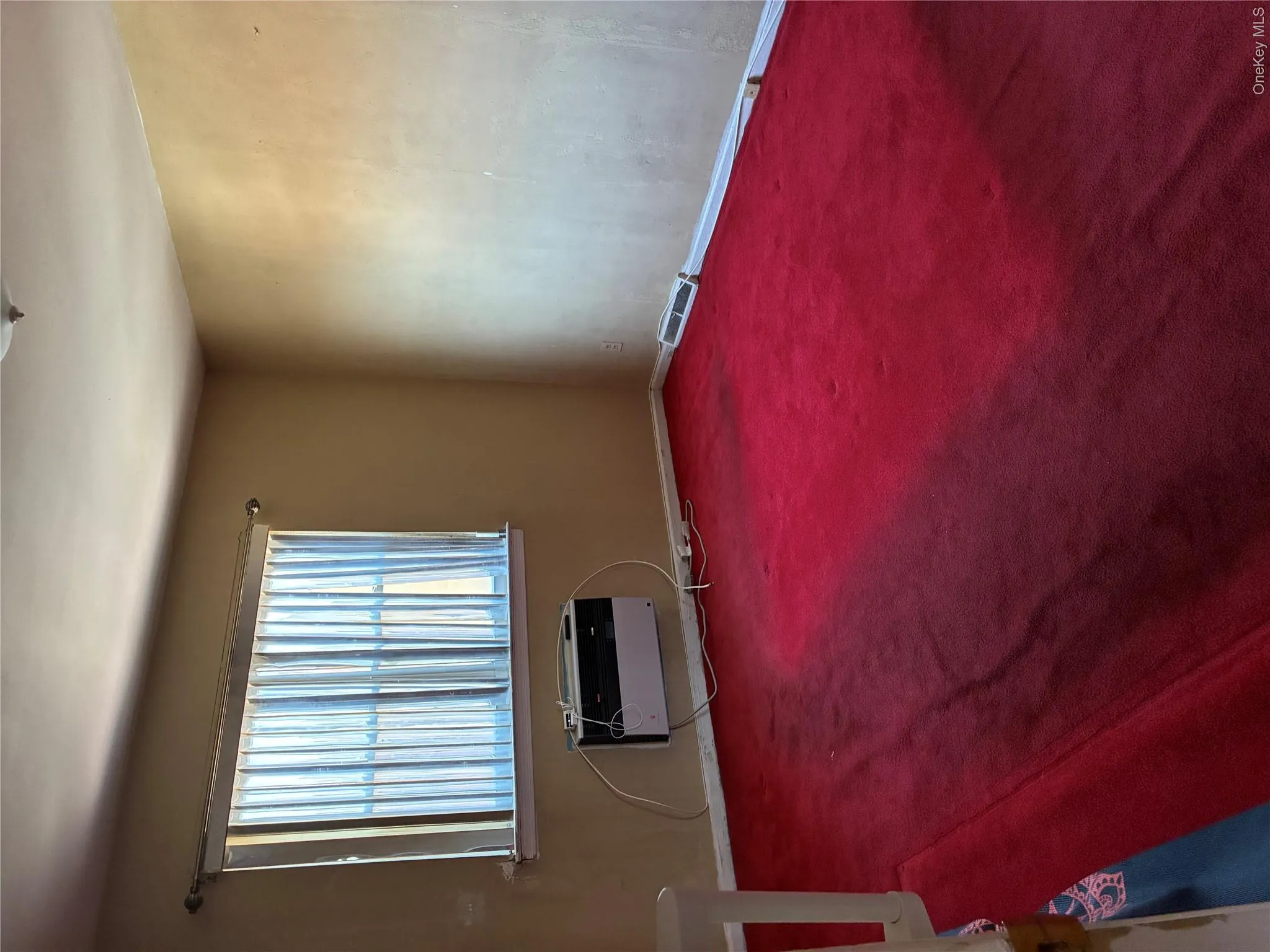 View of medium-sized bedroom with air conditioning unit View of medium-sized bedroom with air conditioning unit