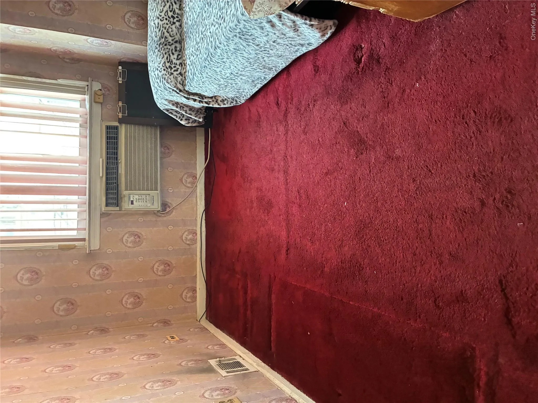 Smaller bedroom showing window and air conditioning unit Smaller bedroom showing window and air conditioning unit
