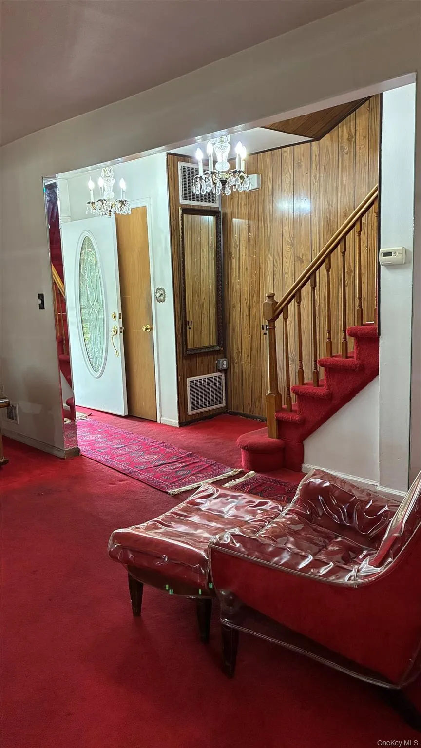 With stairs leading up to second floor With stairs leading up to second floor