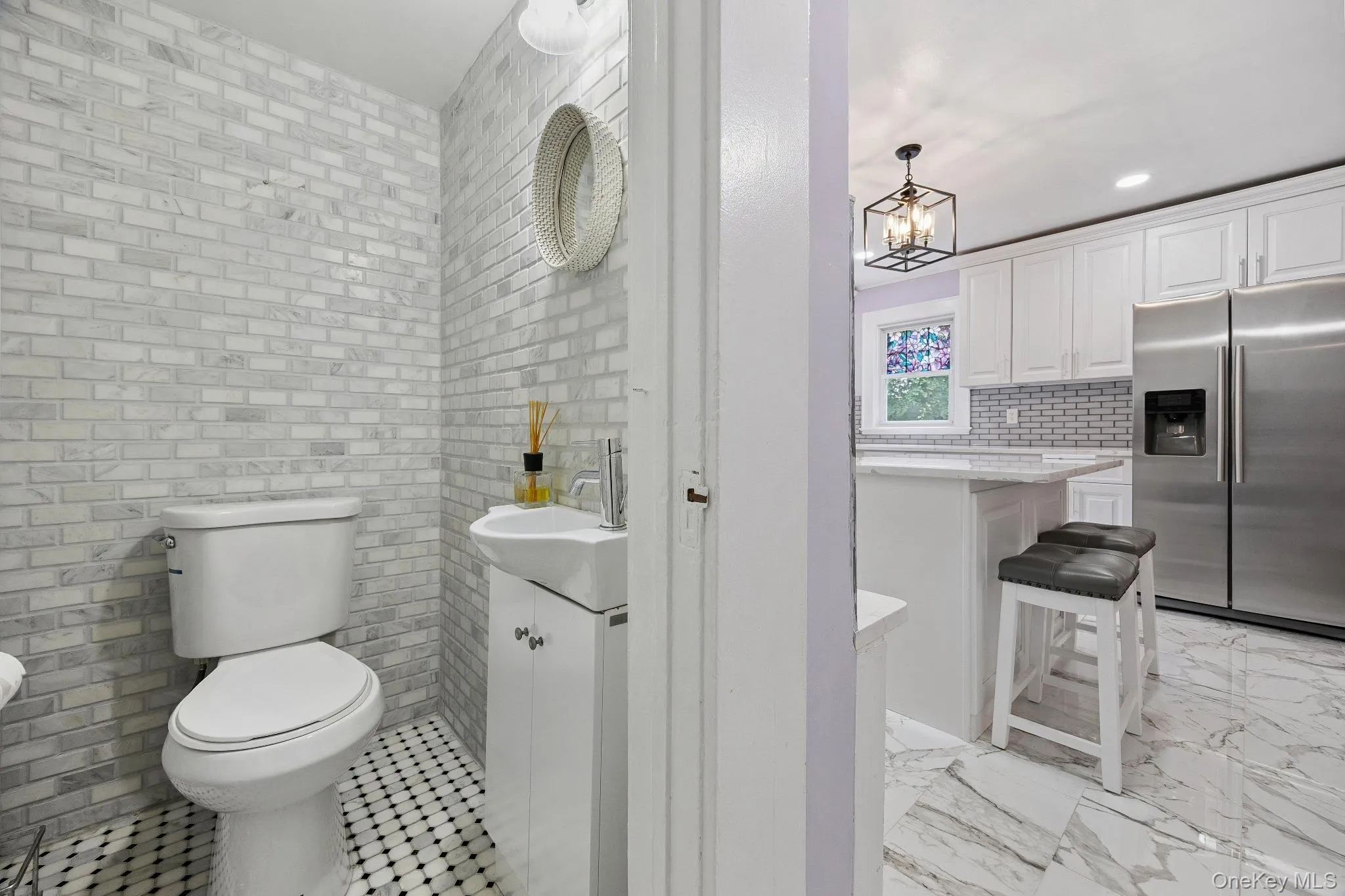 Half bath with a chandelier, vanity, and recessed lighting Half bath with a chandelier, vanity, and recessed lighting