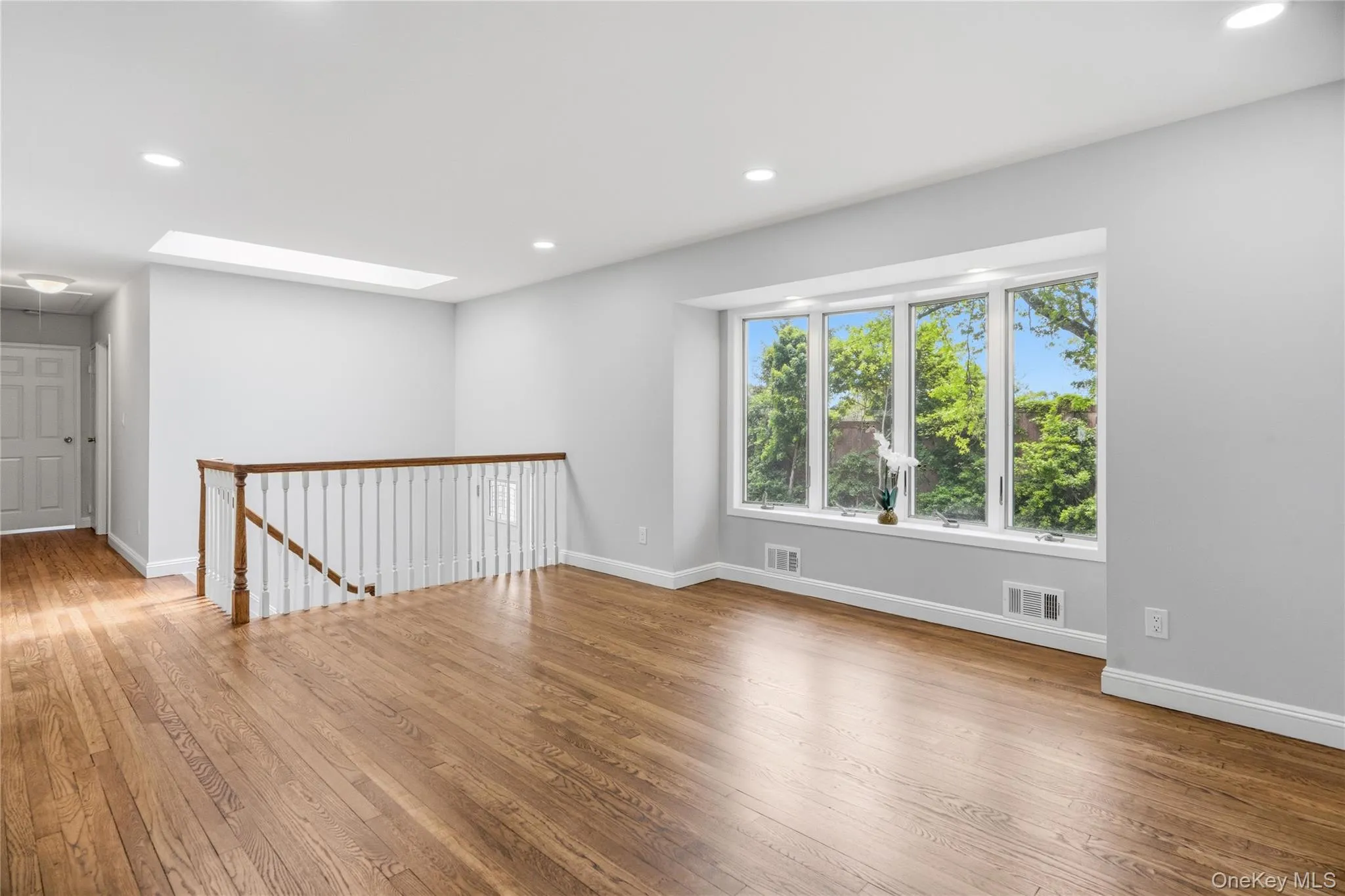 View of Front Yard and Entrance to Hallway and Bedrooms with Wood Finished Floors View of Front Yard and Entrance to Hallway and Bedrooms with Wood Finished Floors