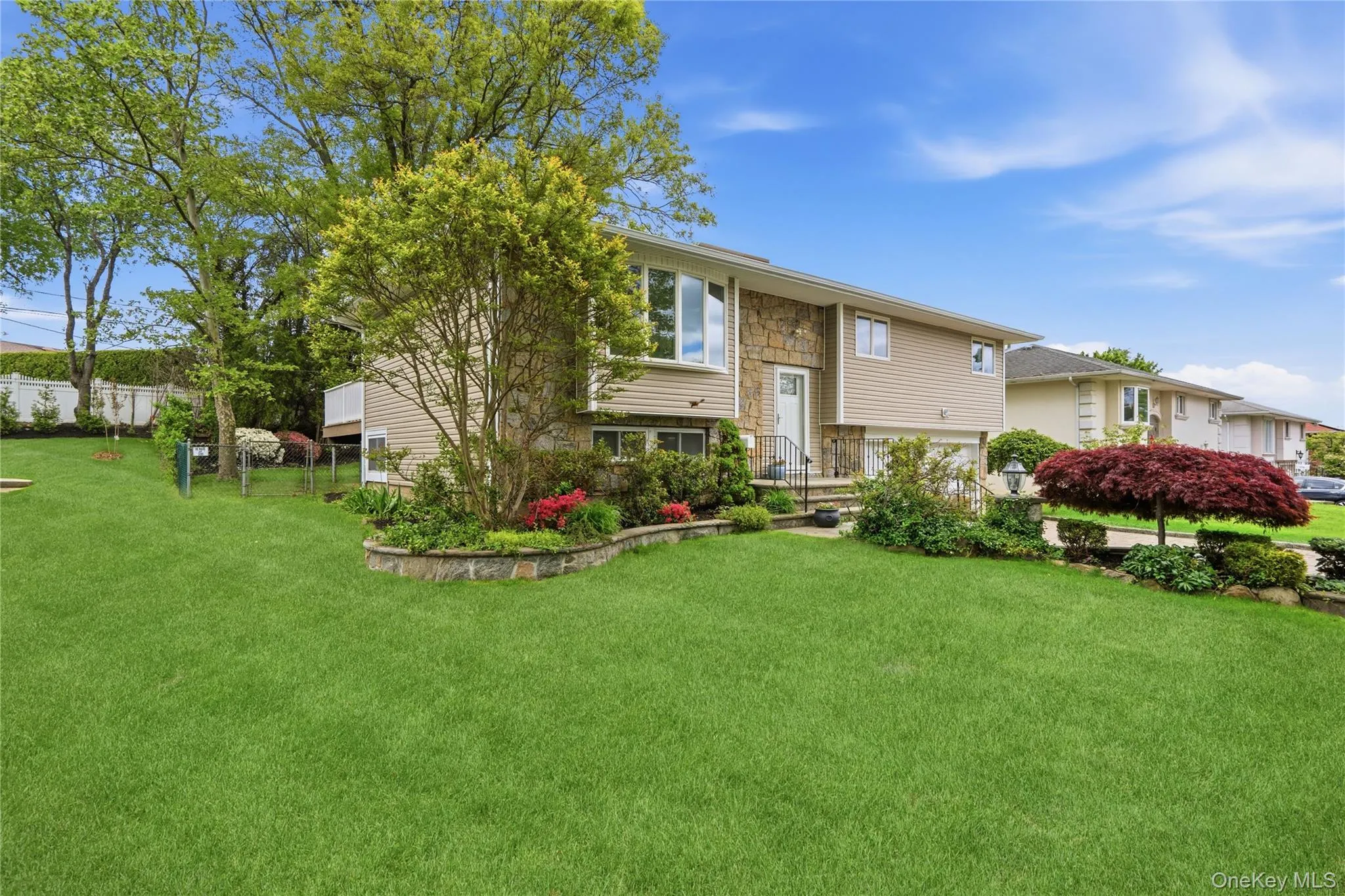Side of Home with plantings and gate to backyard Side of Home with plantings and gate to backyard
