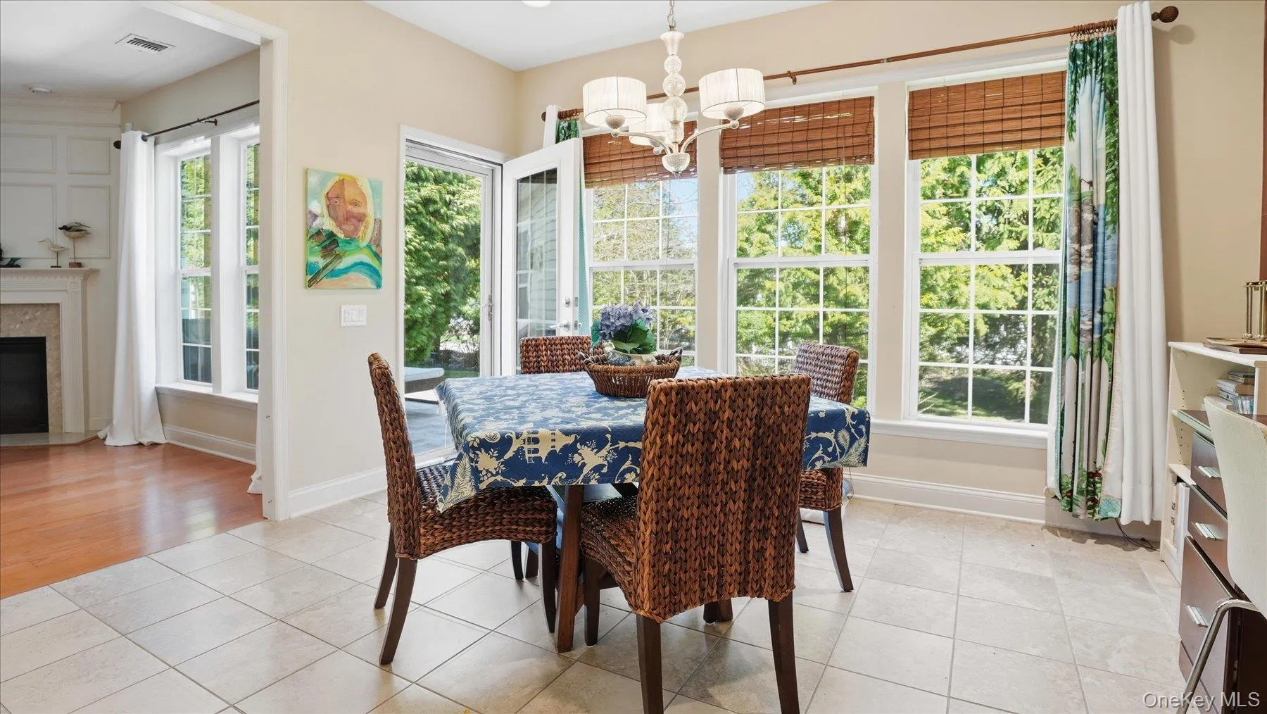 Eating Nook featuring large windows, a glass-paned door and storm door leading o the Private Patio and Backyard Eating Nook featuring large windows, a glass-paned door and storm door leading o the Private Patio and Backyard