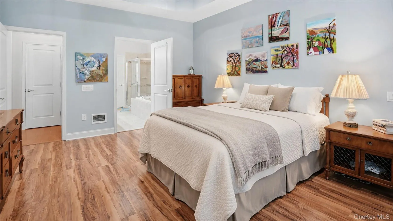 Spacious bedroom with entrance to primary bathroom leading to walk-in-closet Spacious bedroom with entrance to primary bathroom leading to walk-in-closet