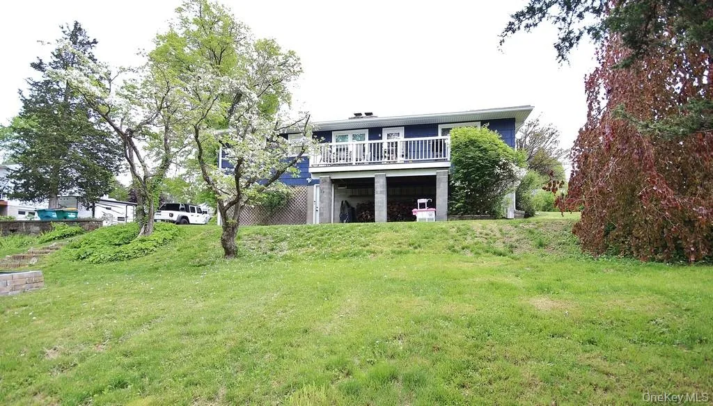 View of the back of the house from the yard. View of the back of the house from the yard.