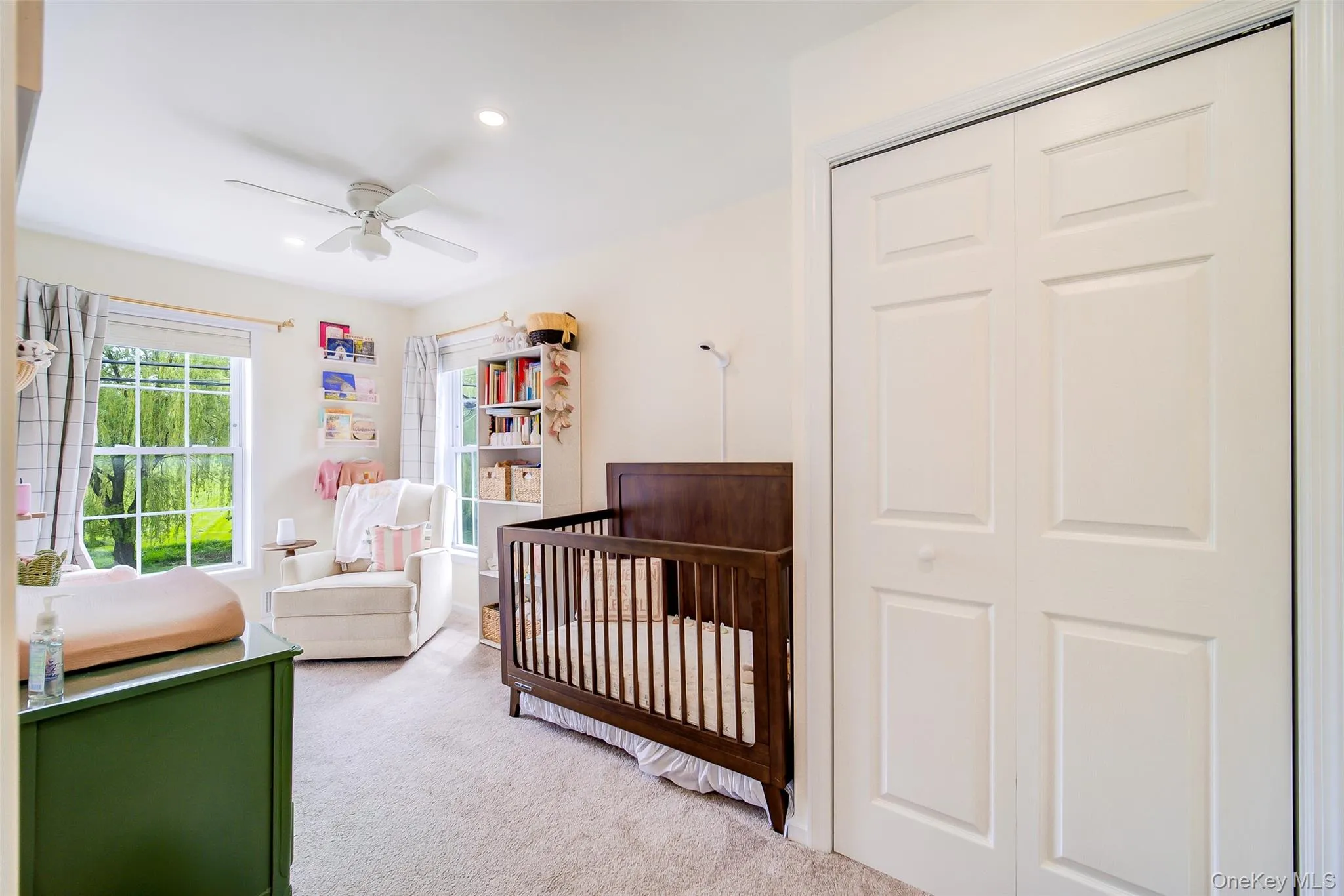 Carpeted bedroom featuring multiple windows, recessed lighting, and a ceiling fan Carpeted bedroom featuring multiple windows, recessed lighting, and a ceiling fan