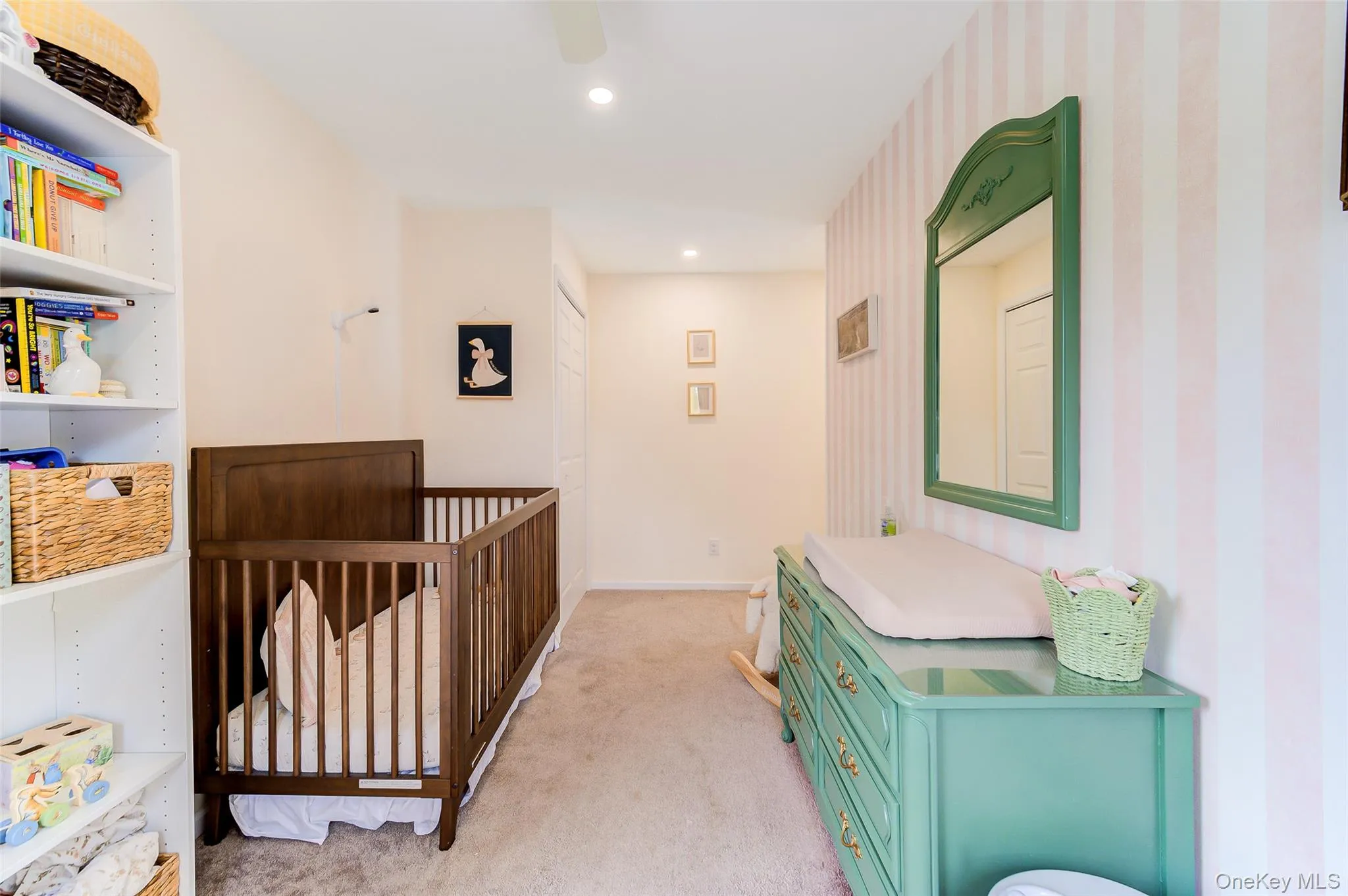 Carpeted interior space featuring recessed lighting and a ceiling fan Carpeted interior space featuring recessed lighting and a ceiling fan
