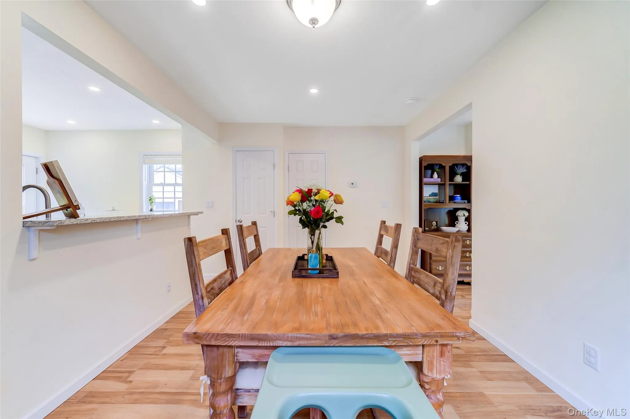 Dining area featuring recessed lighting and wood-finish flooring Dining area featuring recessed lighting and wood-finish flooring