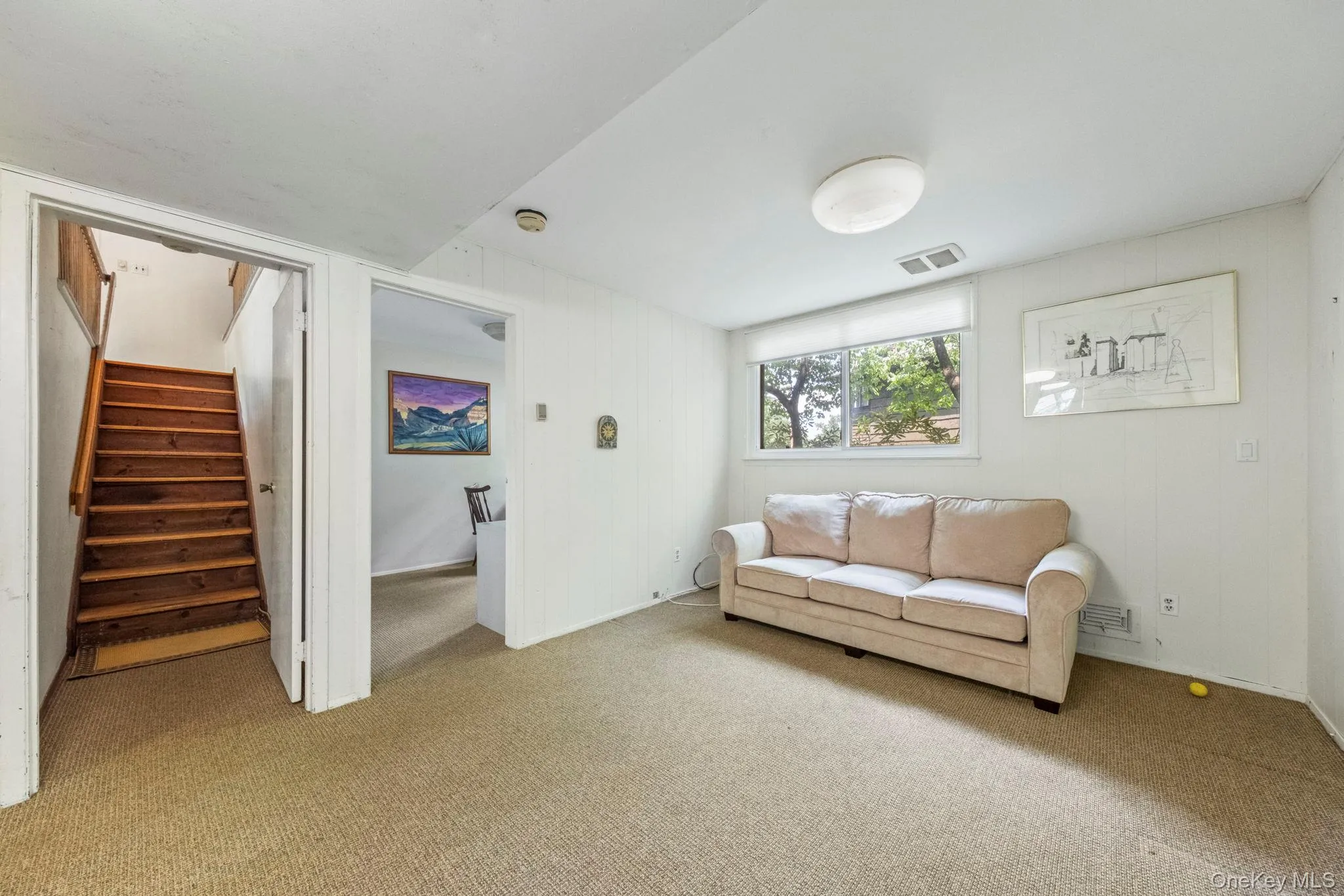 Lower level includes large media/playroom with mirrored closets Lower level includes large media/playroom with mirrored closets