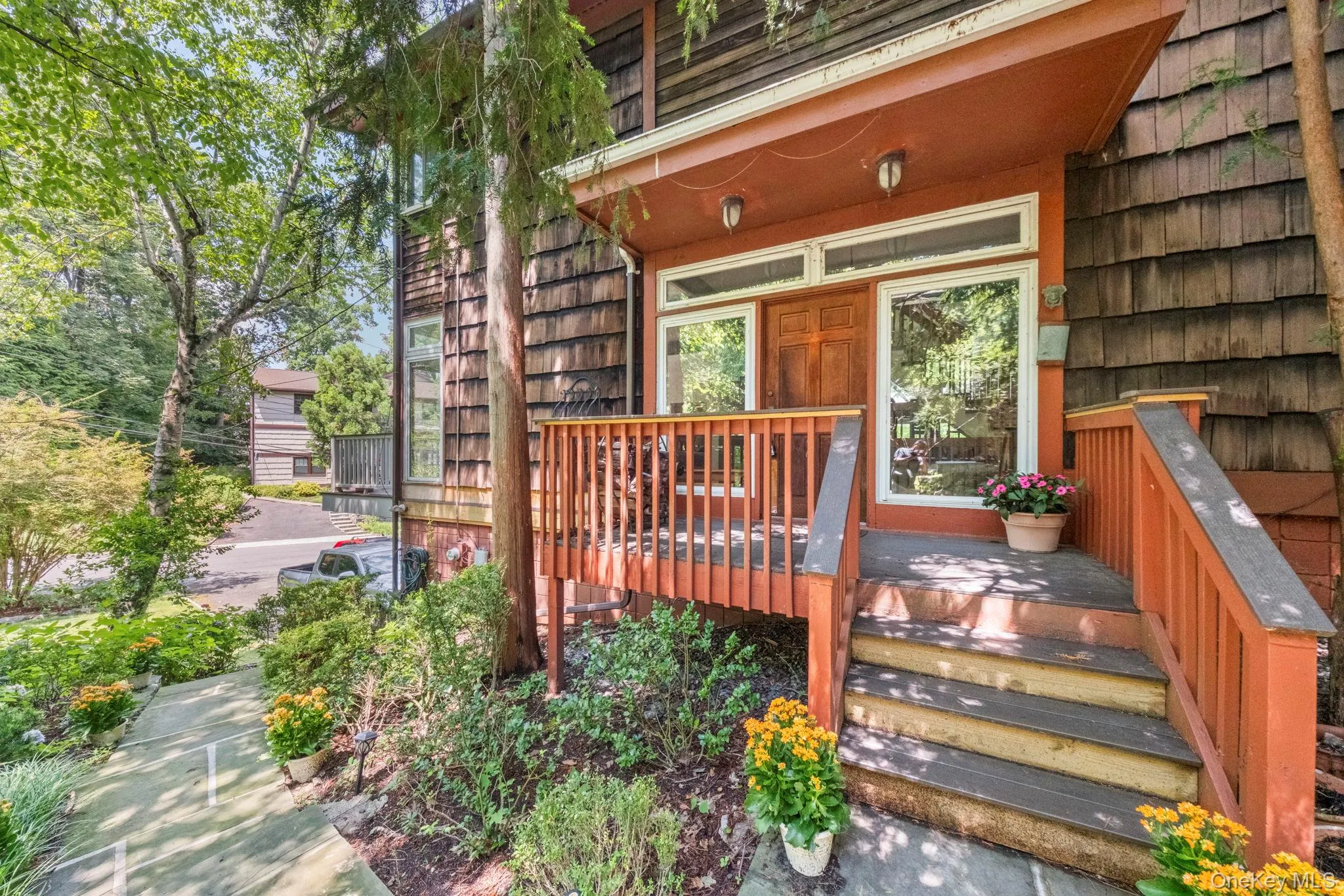 Wood shingle exterior featuring a covered entryway Wood shingle exterior featuring a covered entryway