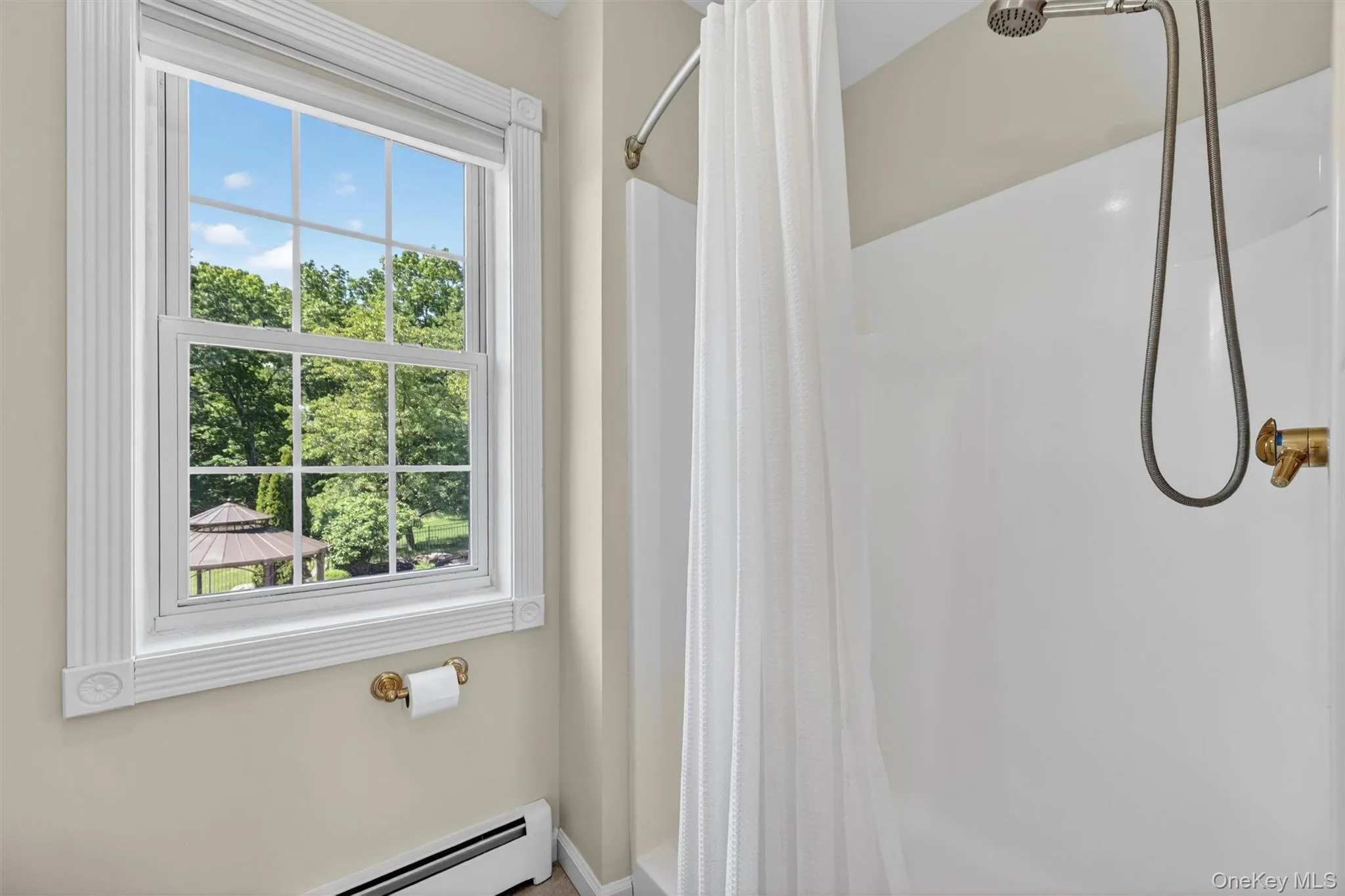 A step-in shower and peaceful window view complete the second-floor ensuite, creating a bright and practical bath space for this private upstairs suite. A step-in shower and peaceful window view complete the second-floor ensuite, creating a bright and practical bath space for this private upstairs suite.