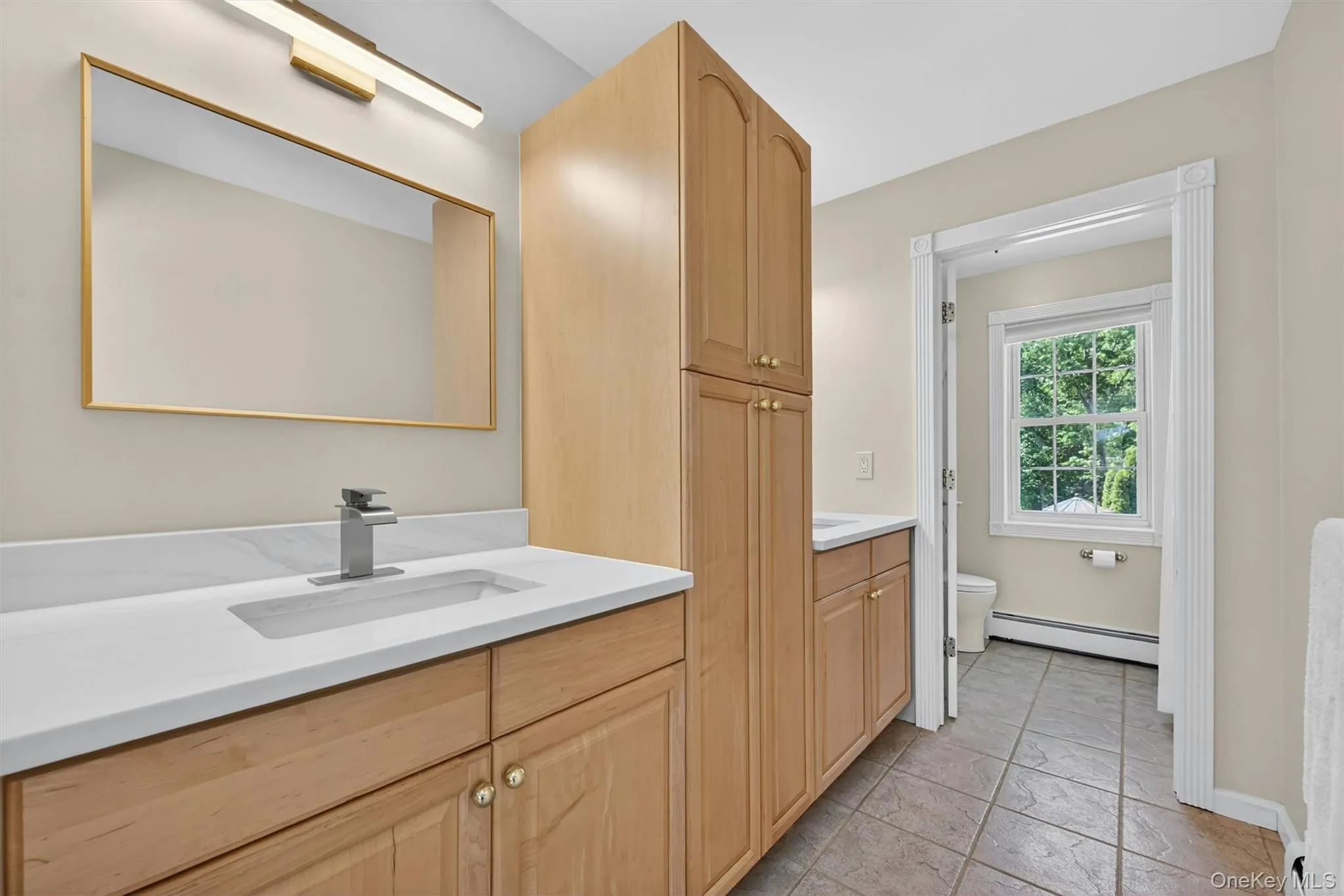 The second-floor ensuite bath is designed with everyday comfort in mind, offering dual sinks, generous linen storage, and a calm, functional layout that keeps everything within easy reach. The second-floor ensuite bath is designed with everyday comfort in mind, offering dual sinks, generous linen storage, and a calm, functional layout that keeps everything within easy reach.
