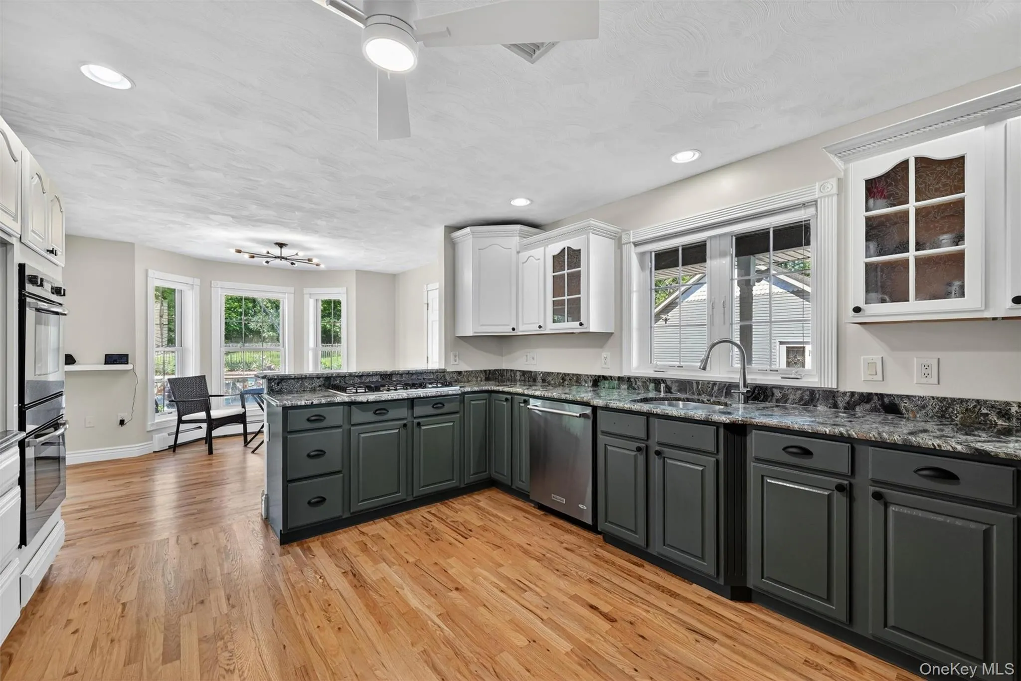 Abundant counter space, generous storage, and a bright connection to the dining area make this kitchen practical and inviting. Abundant counter space, generous storage, and a bright connection to the dining area make this kitchen practical and inviting.