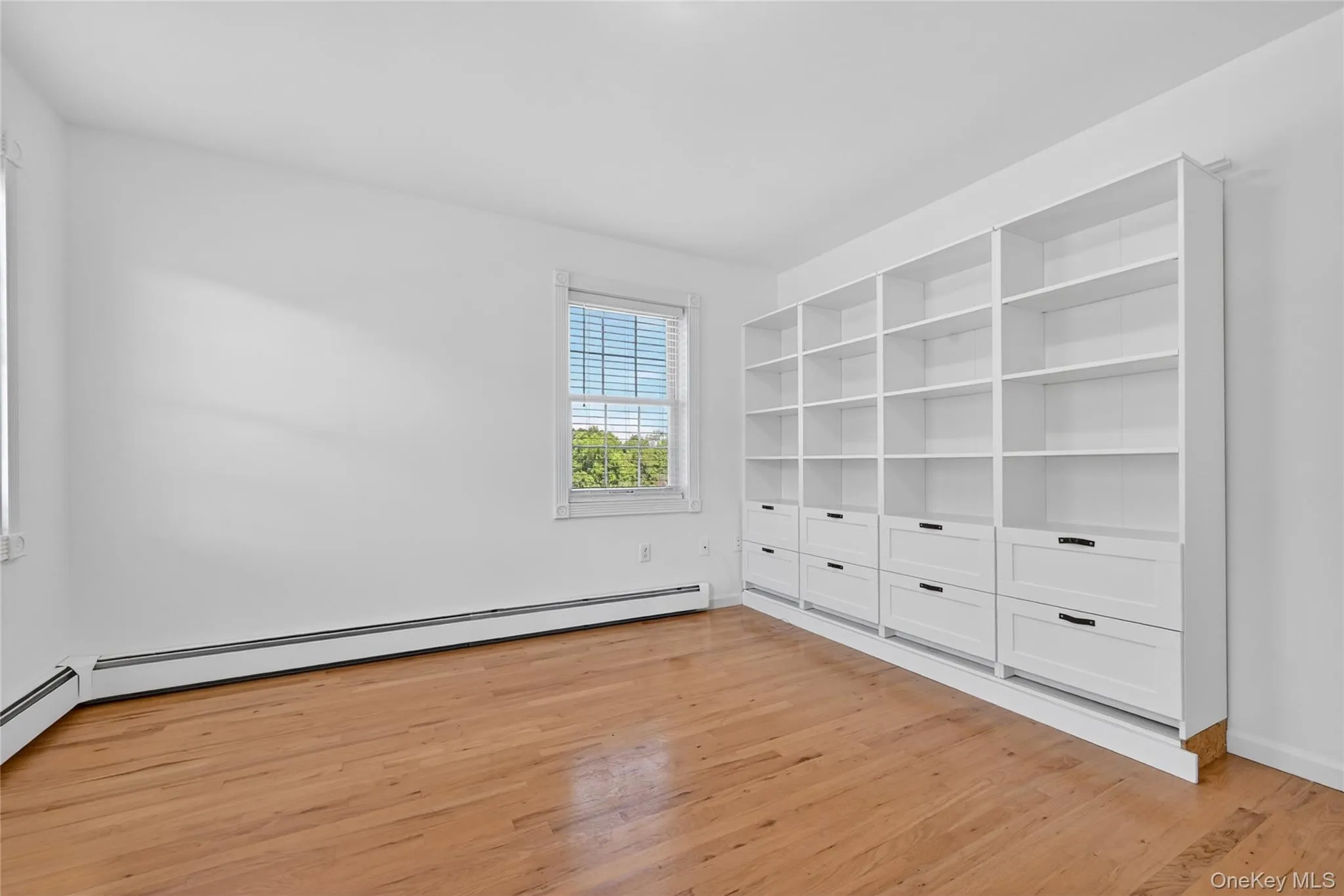 Built-in shelving and drawers add function and charm to this versatile flex room, creating a practical place for work, hobbies, storage, or creative projects. Built-in shelving and drawers add function and charm to this versatile flex room, creating a practical place for work, hobbies, storage, or creative projects.