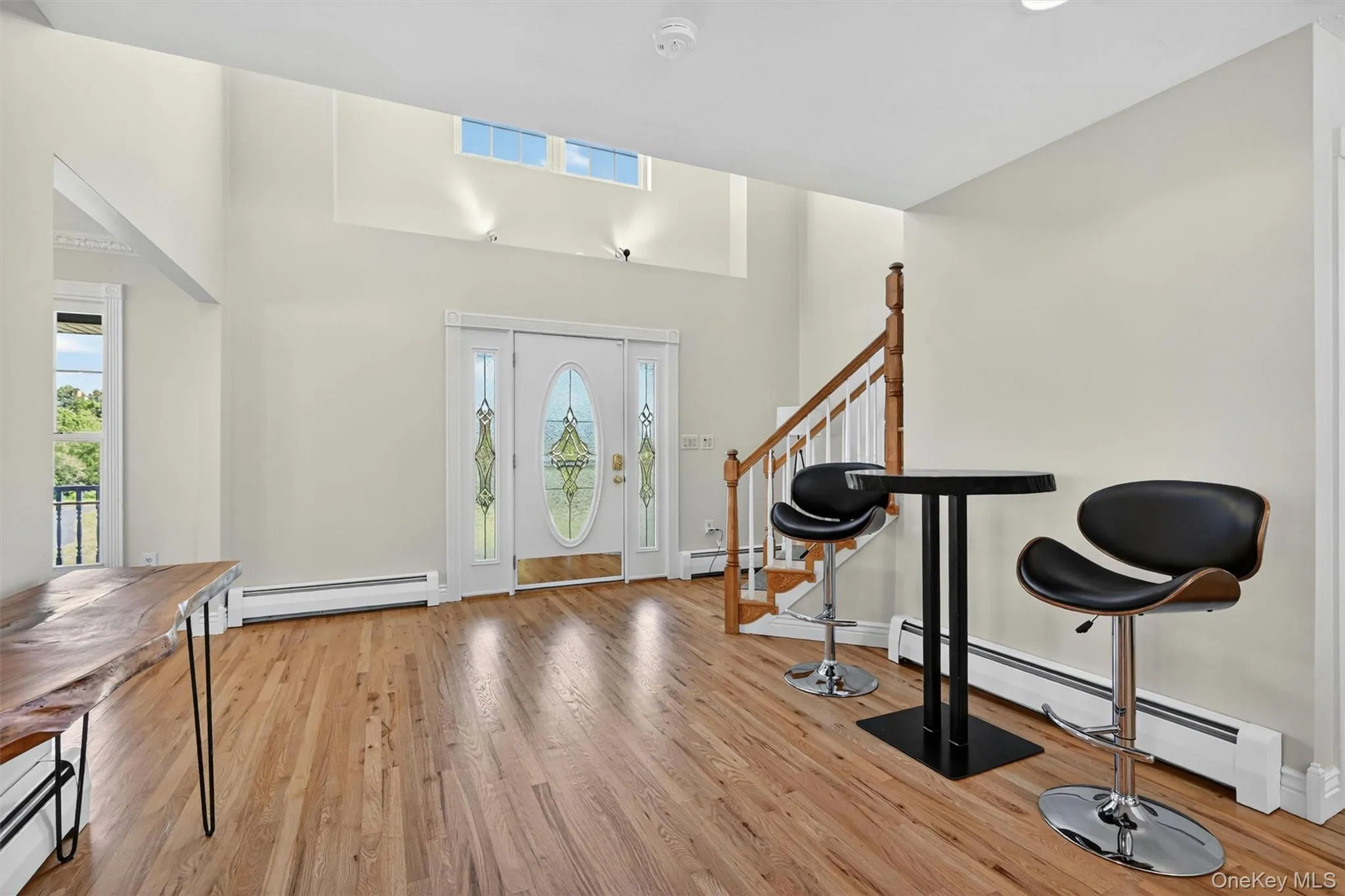 The entry feels open and airy, with natural light, tall ceilings, and a graceful staircase setting the tone for the rest of the home. The entry feels open and airy, with natural light, tall ceilings, and a graceful staircase setting the tone for the rest of the home.