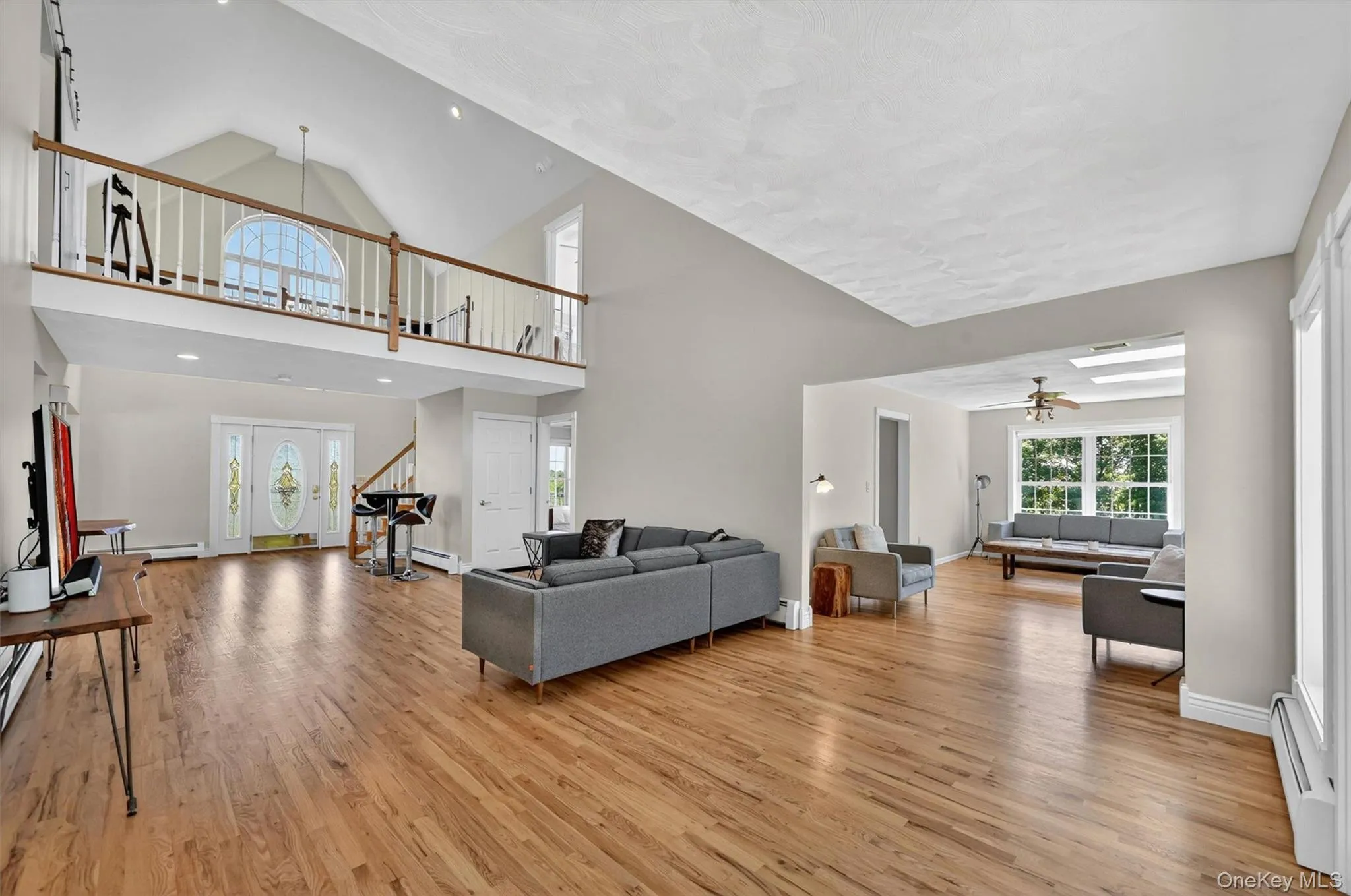 This spacious living area offers room to gather, relax, and entertain, with beautiful natural light and an open connection between spaces. This spacious living area offers room to gather, relax, and entertain, with beautiful natural light and an open connection between spaces.