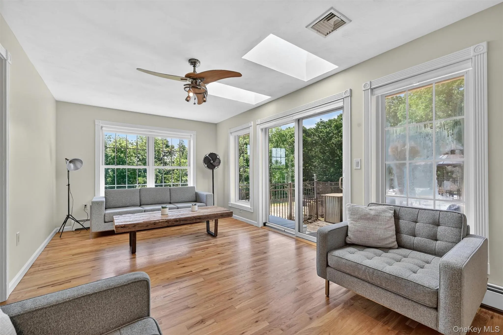 Bright, open, and relaxed, this family room offers a comfortable place to enjoy natural light with a beautiful view of the patio. Bright, open, and relaxed, this family room offers a comfortable place to enjoy natural light with a beautiful view of the patio.