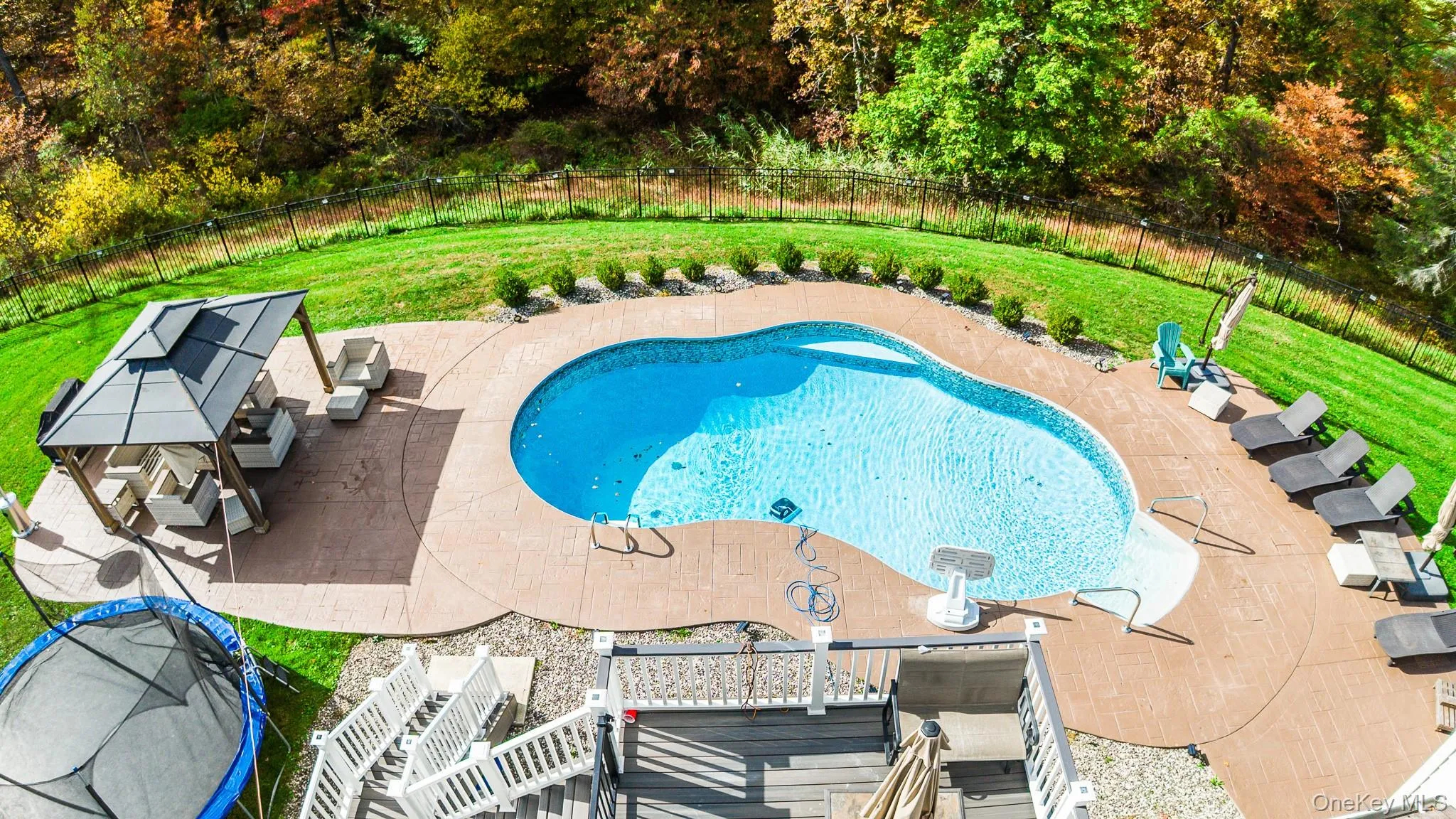 View of pool with a patio area and a fenced backyard View of pool with a patio area and a fenced backyard